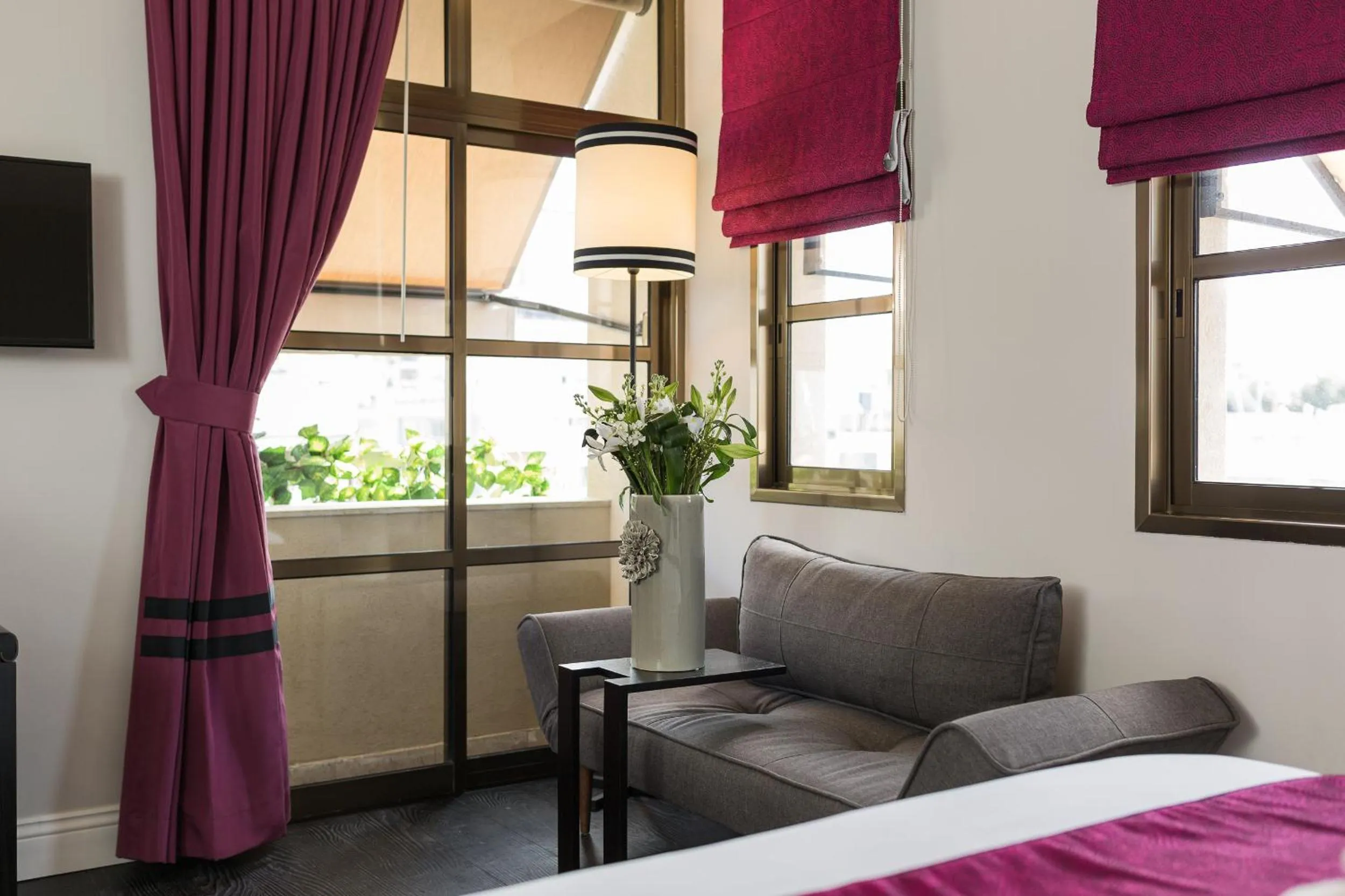 Seating area, Bed in A23 Boutique Hotel