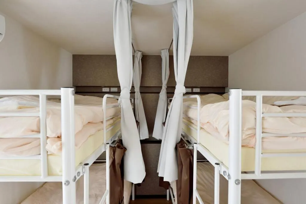 Bed in Keimei Guest House