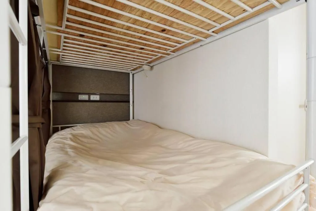 Bed in Keimei Guest House