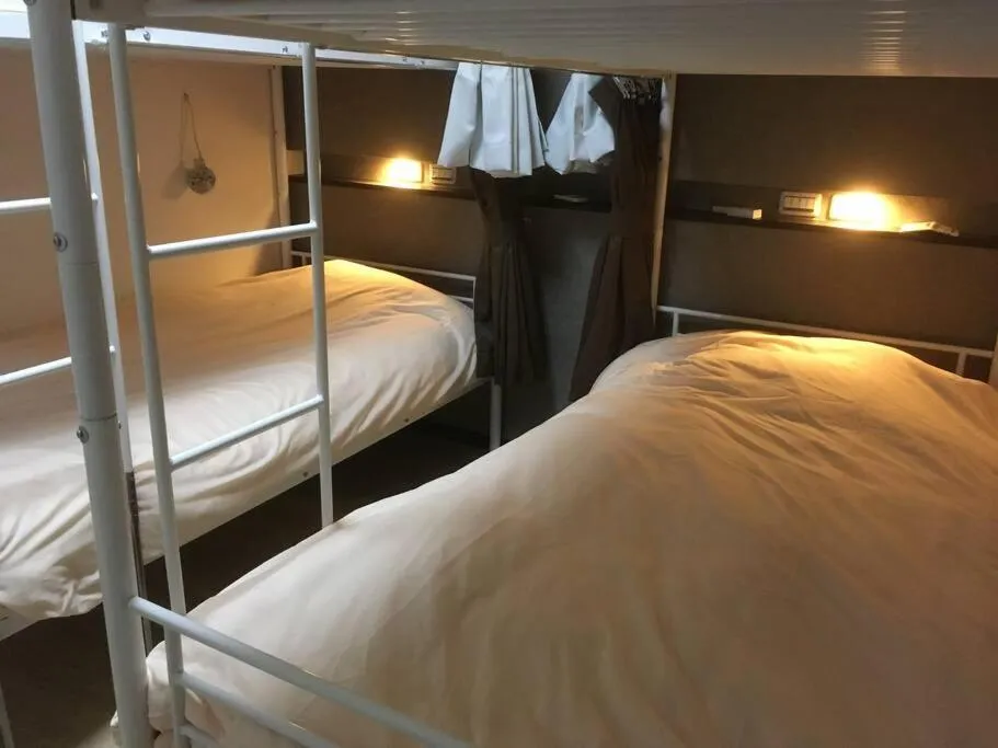 Bed in Keimei Guest House