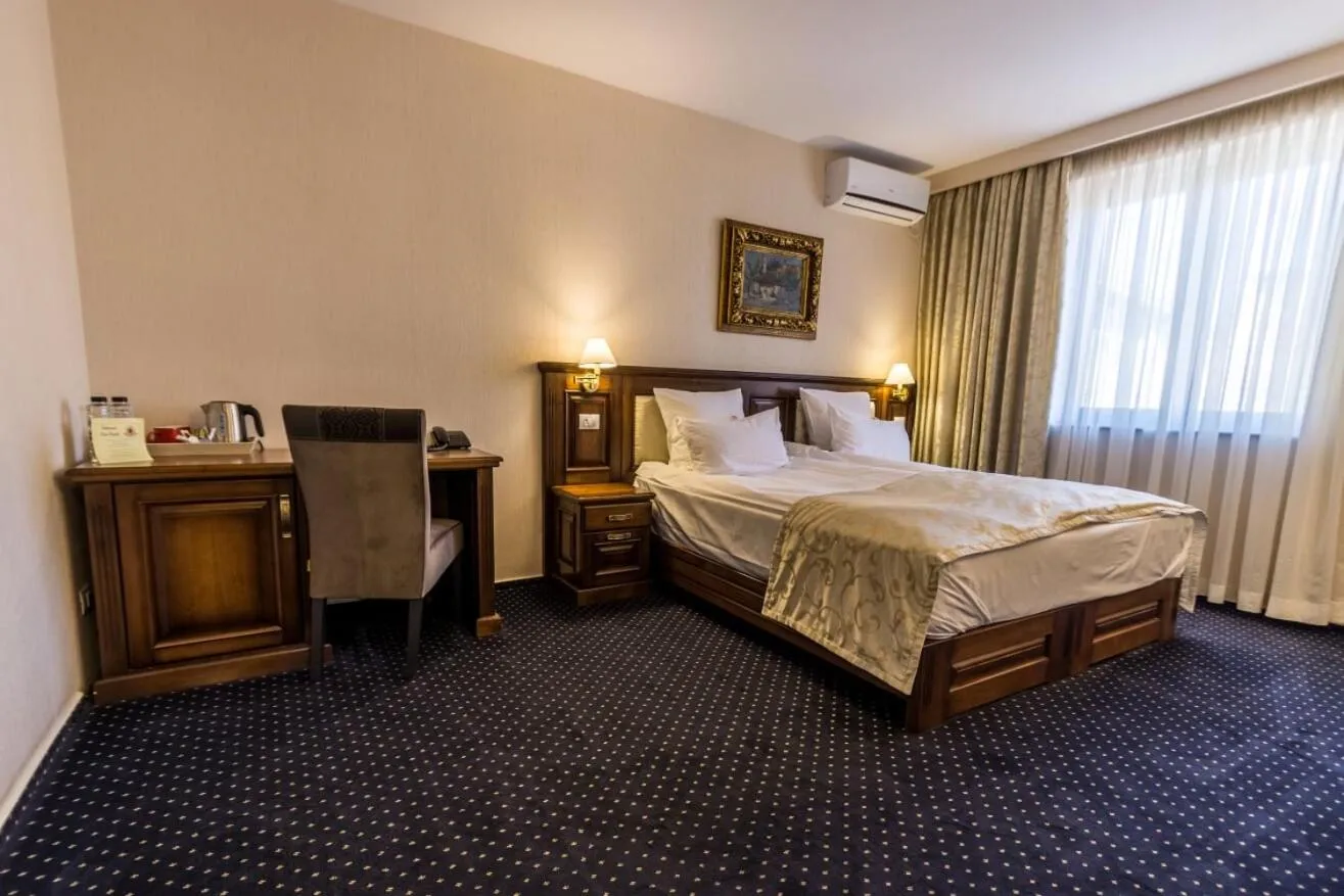 Bed in Noblesse Boutique Resort