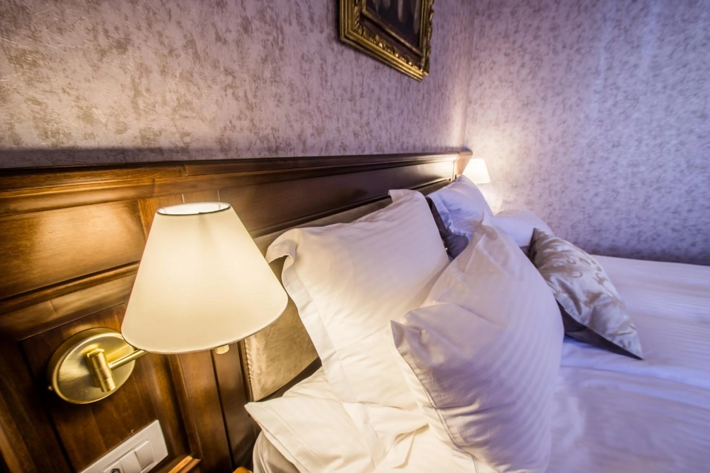 Bed in Noblesse Boutique Resort