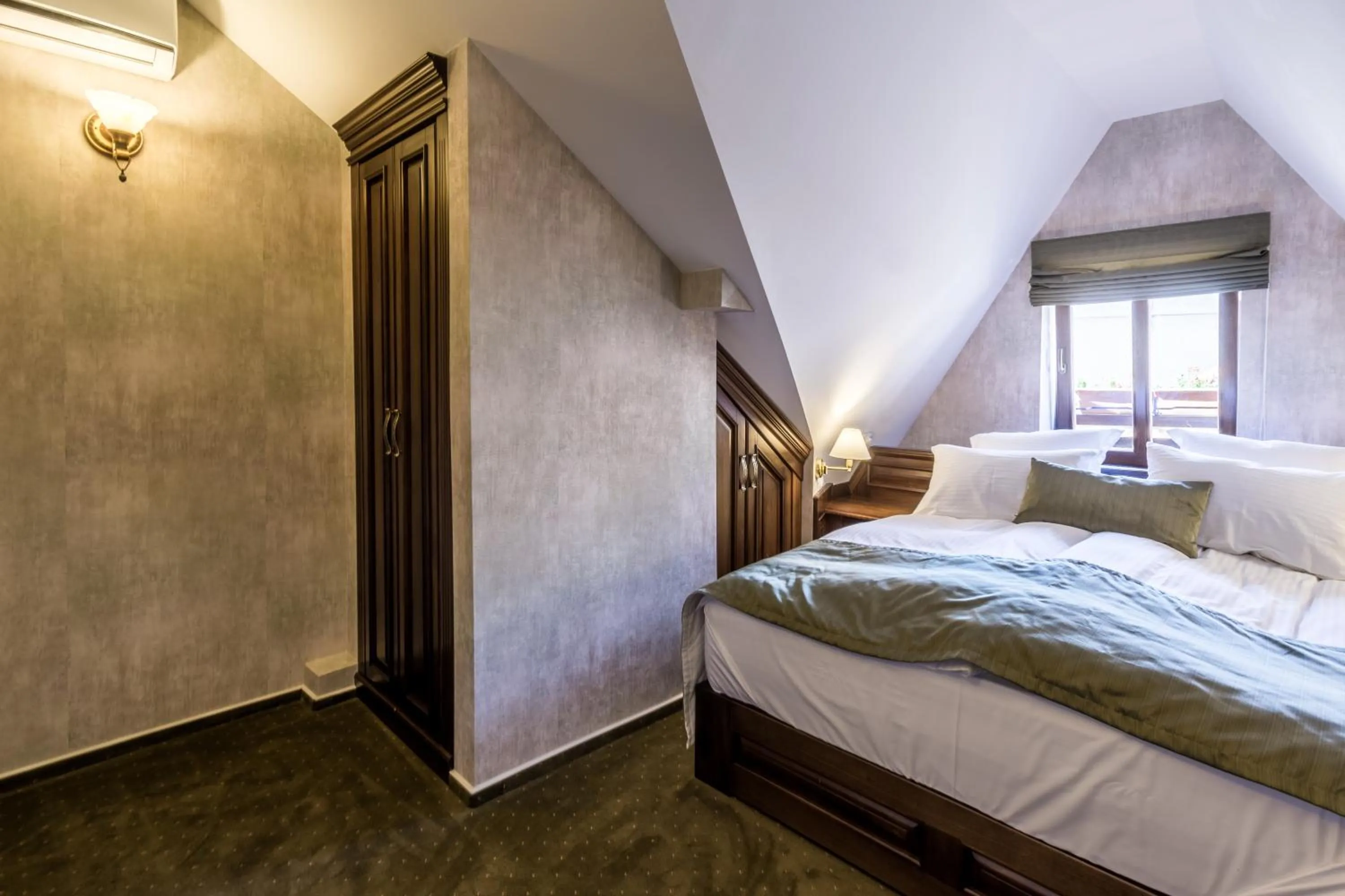 Bed in Noblesse Boutique Resort