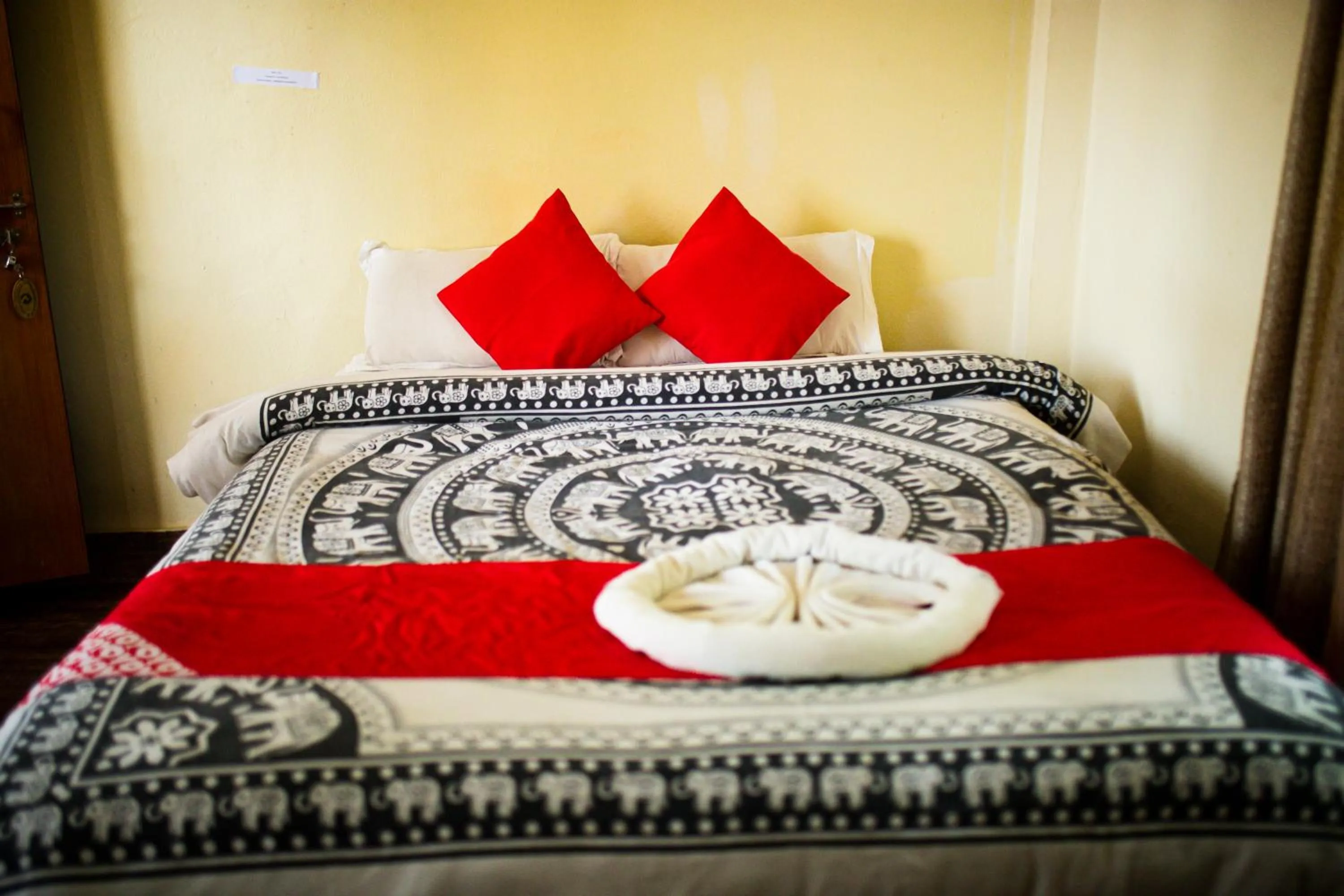 Bed in Chitwan Riverside Resort