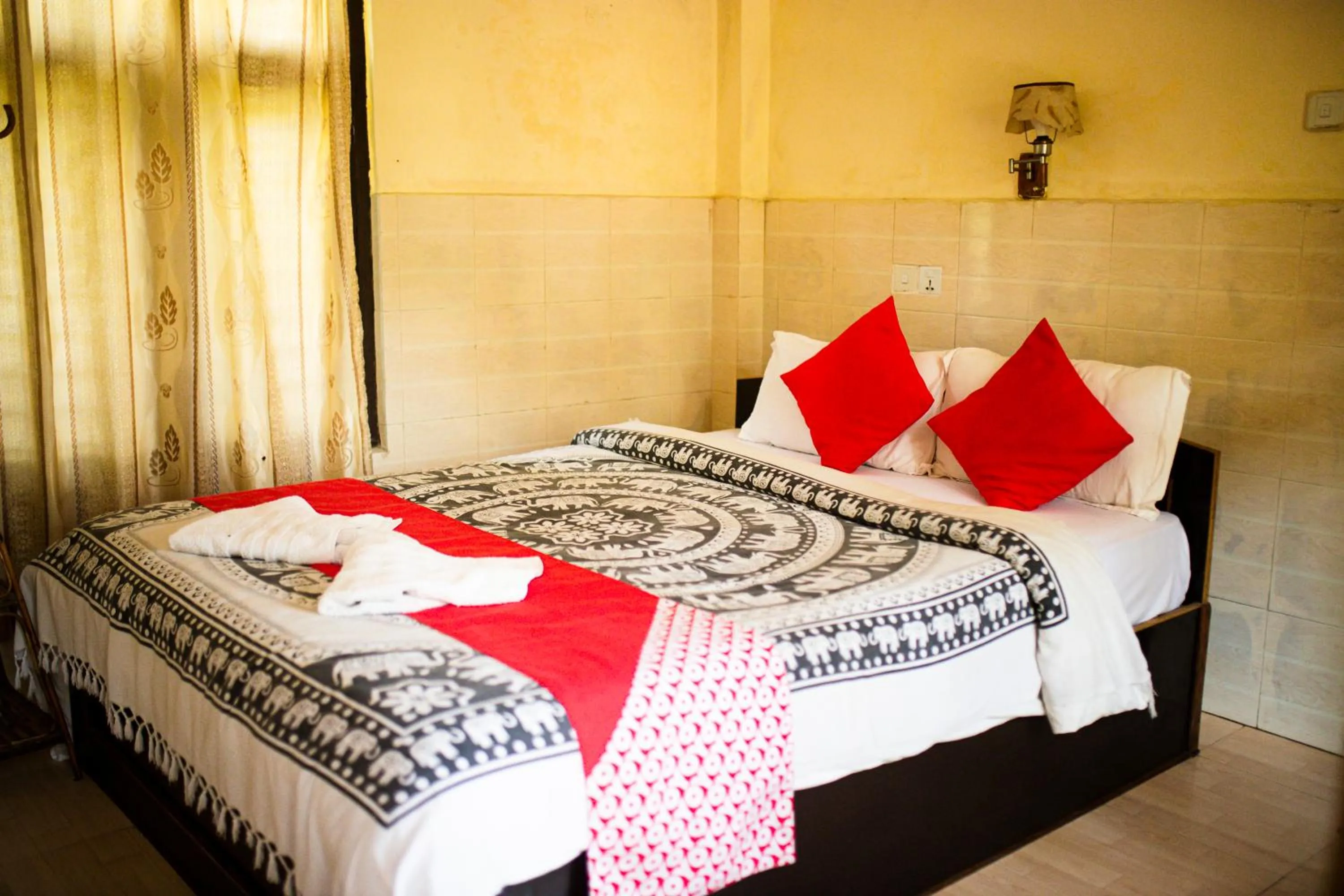 Bed in Chitwan Riverside Resort