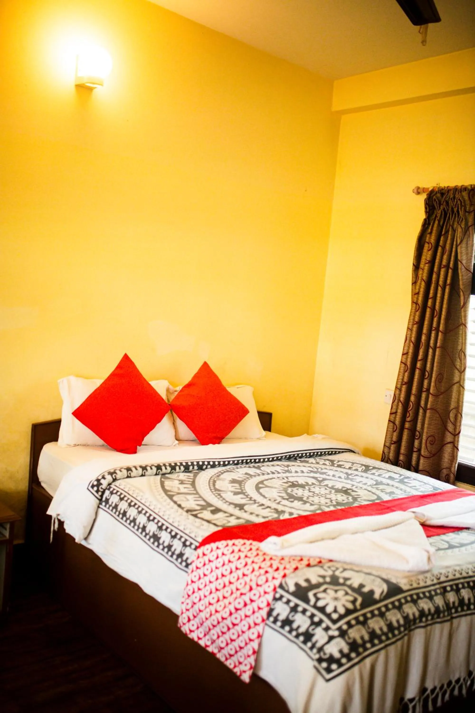 Bed in Chitwan Riverside Resort