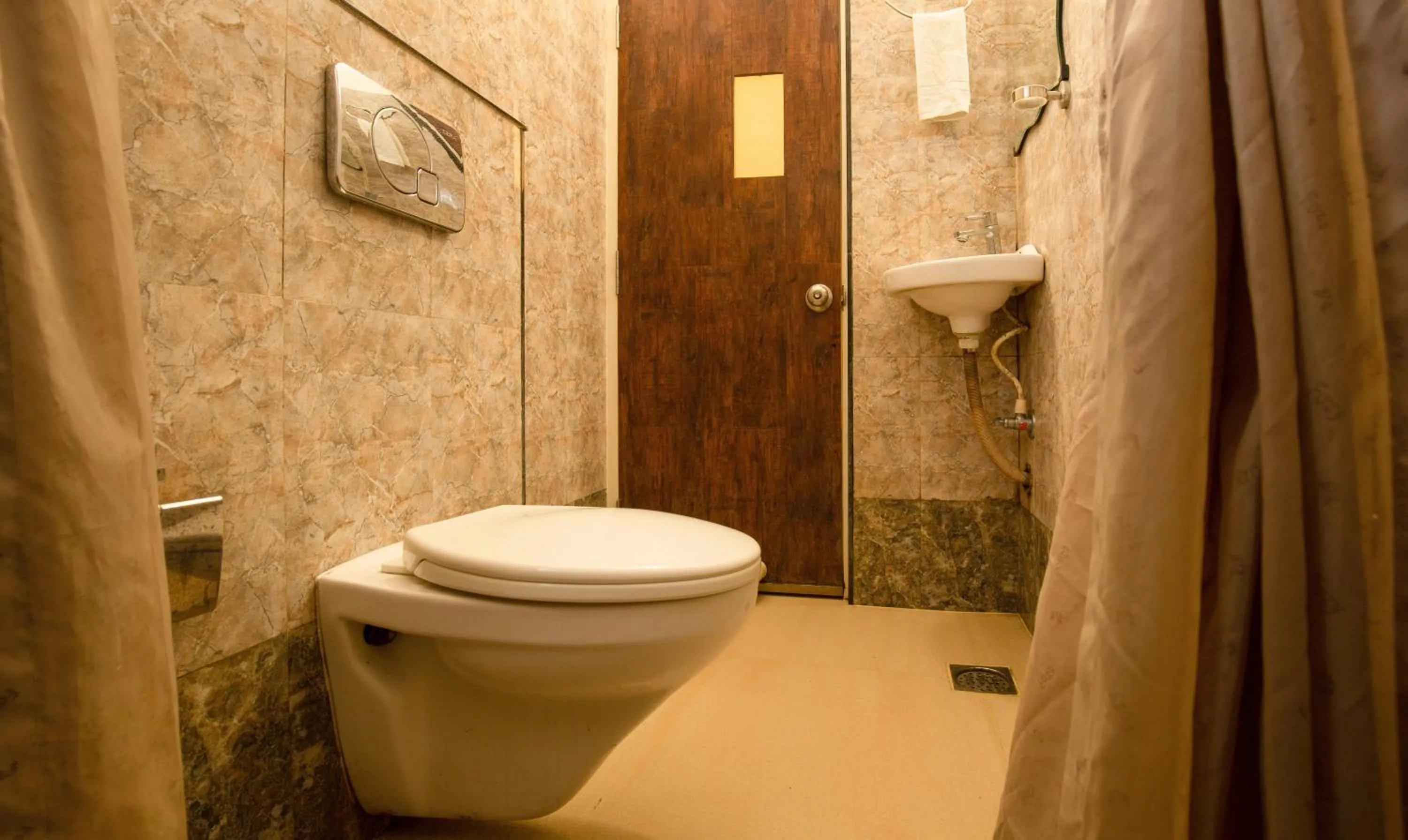 Bathroom in Treebo The Qasr