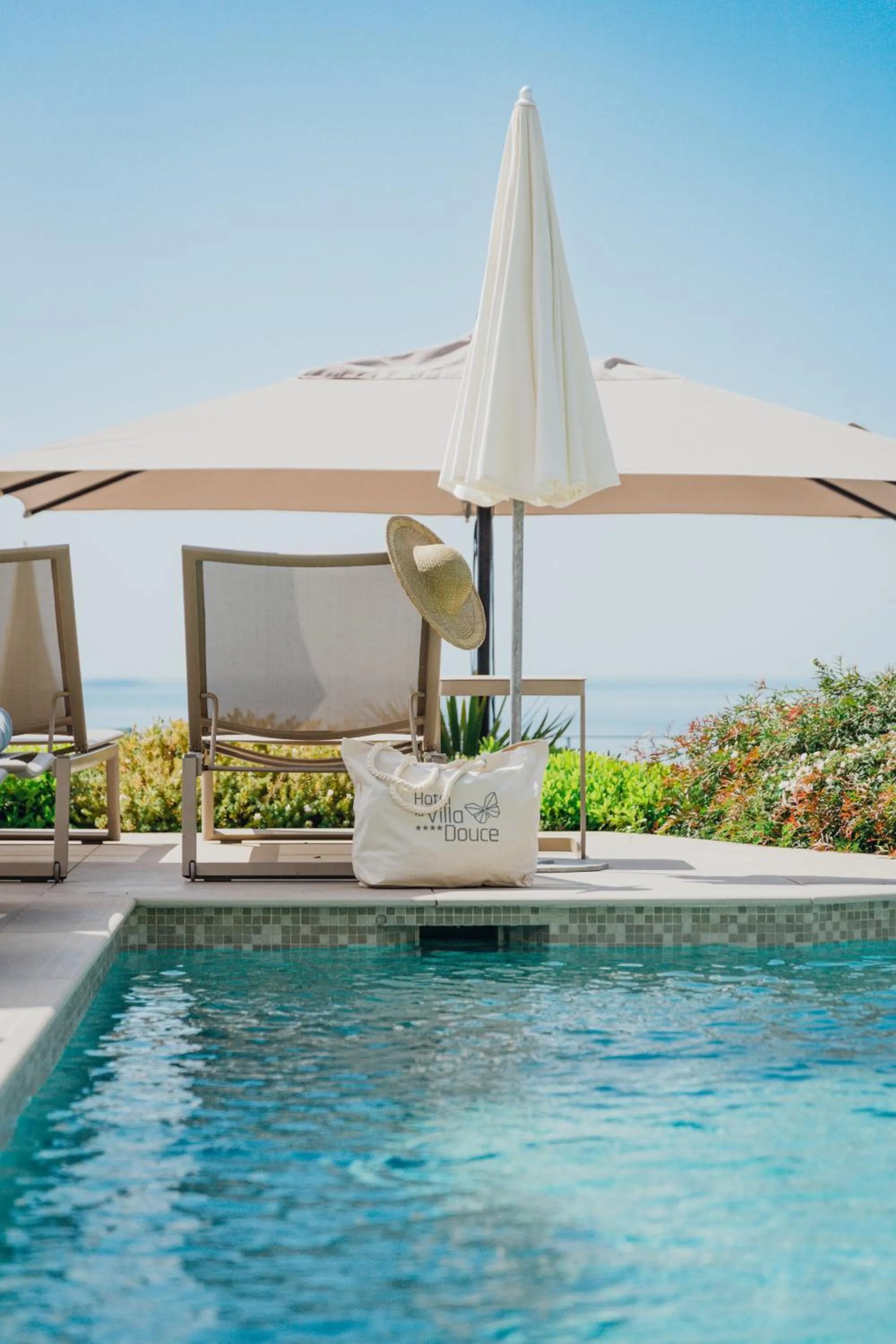 Swimming pool in Hôtel La Villa Douce