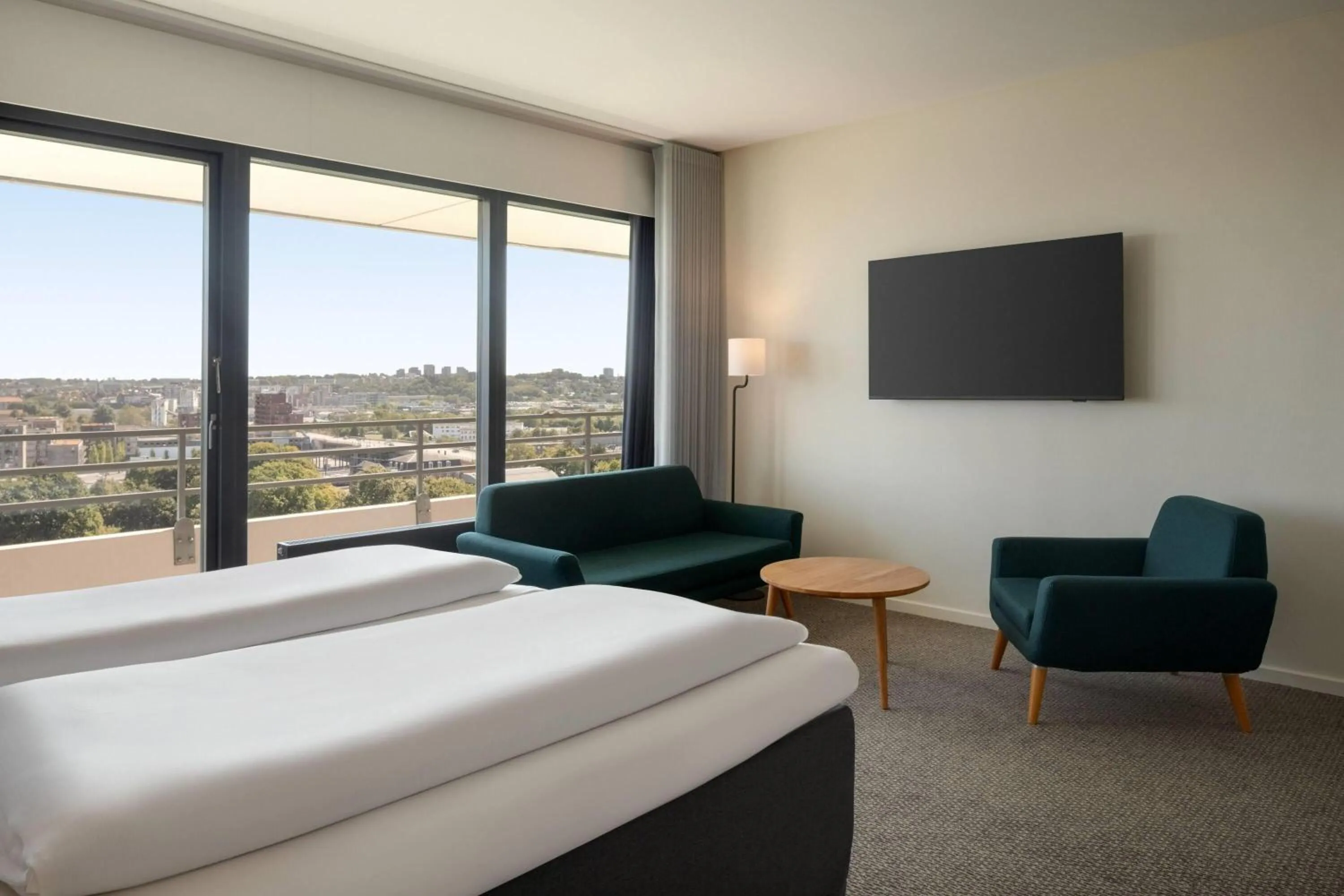 Photo of the whole room, Bed in Comwell Hvide Hus Aalborg, Dolce by Wyndham