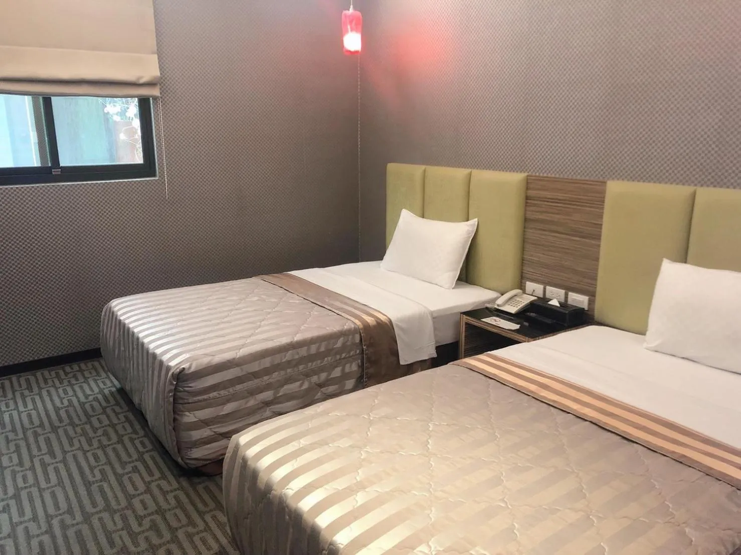 Bed in Esun Villa Hotel