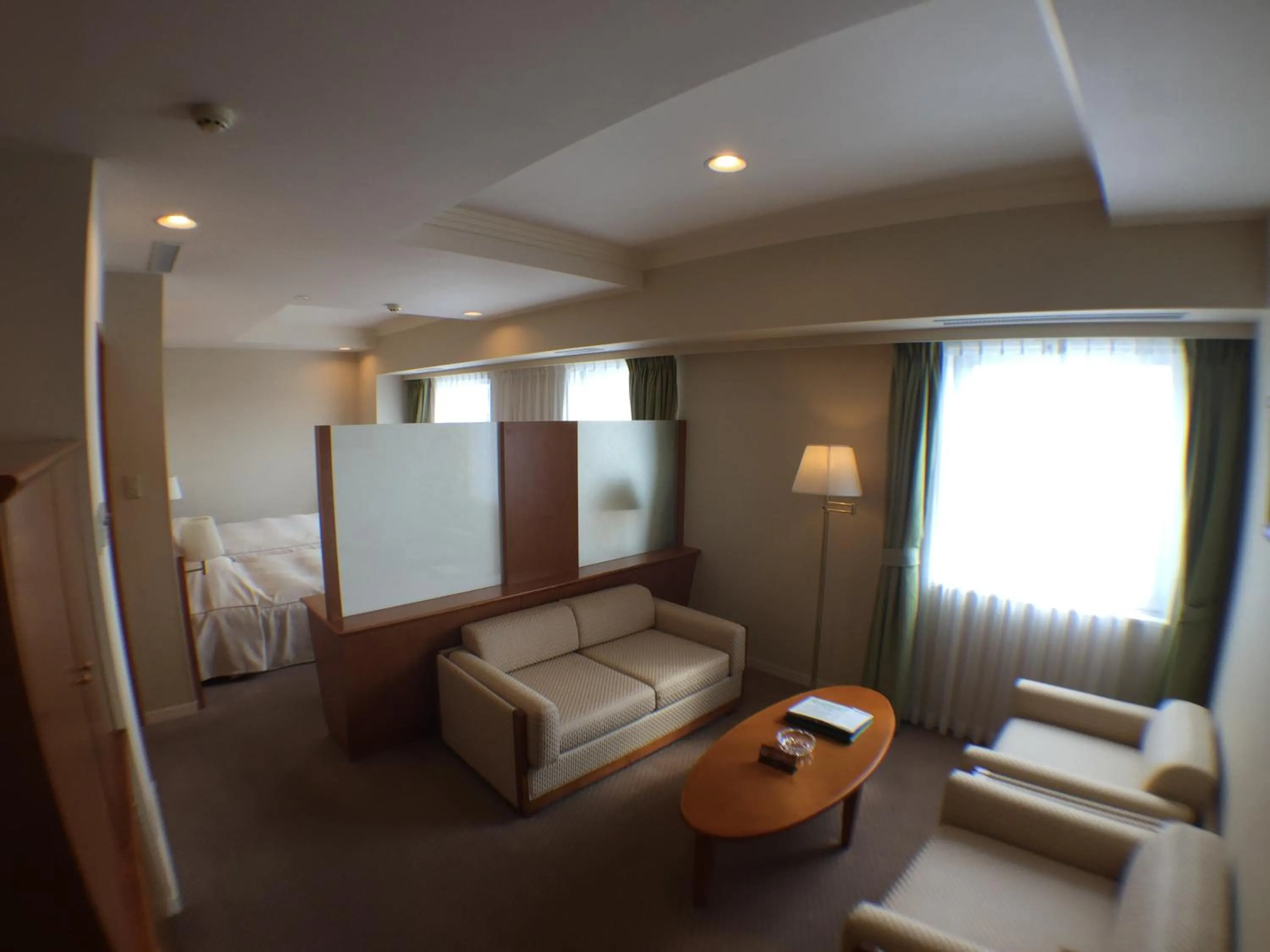 Living room, Bed in Hotel Okhotsk Palace