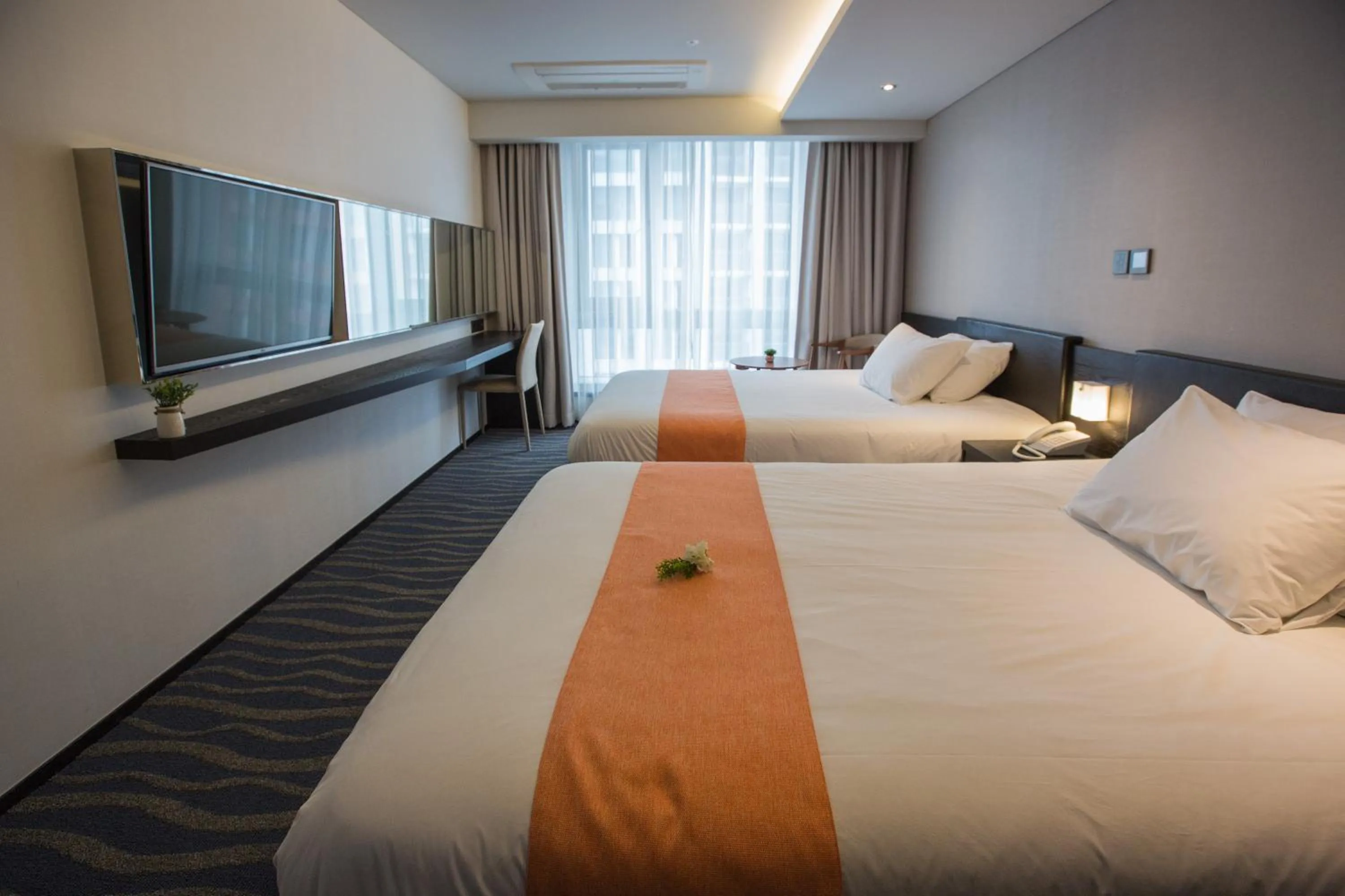 Bed in Gloucester Hotel Jeju