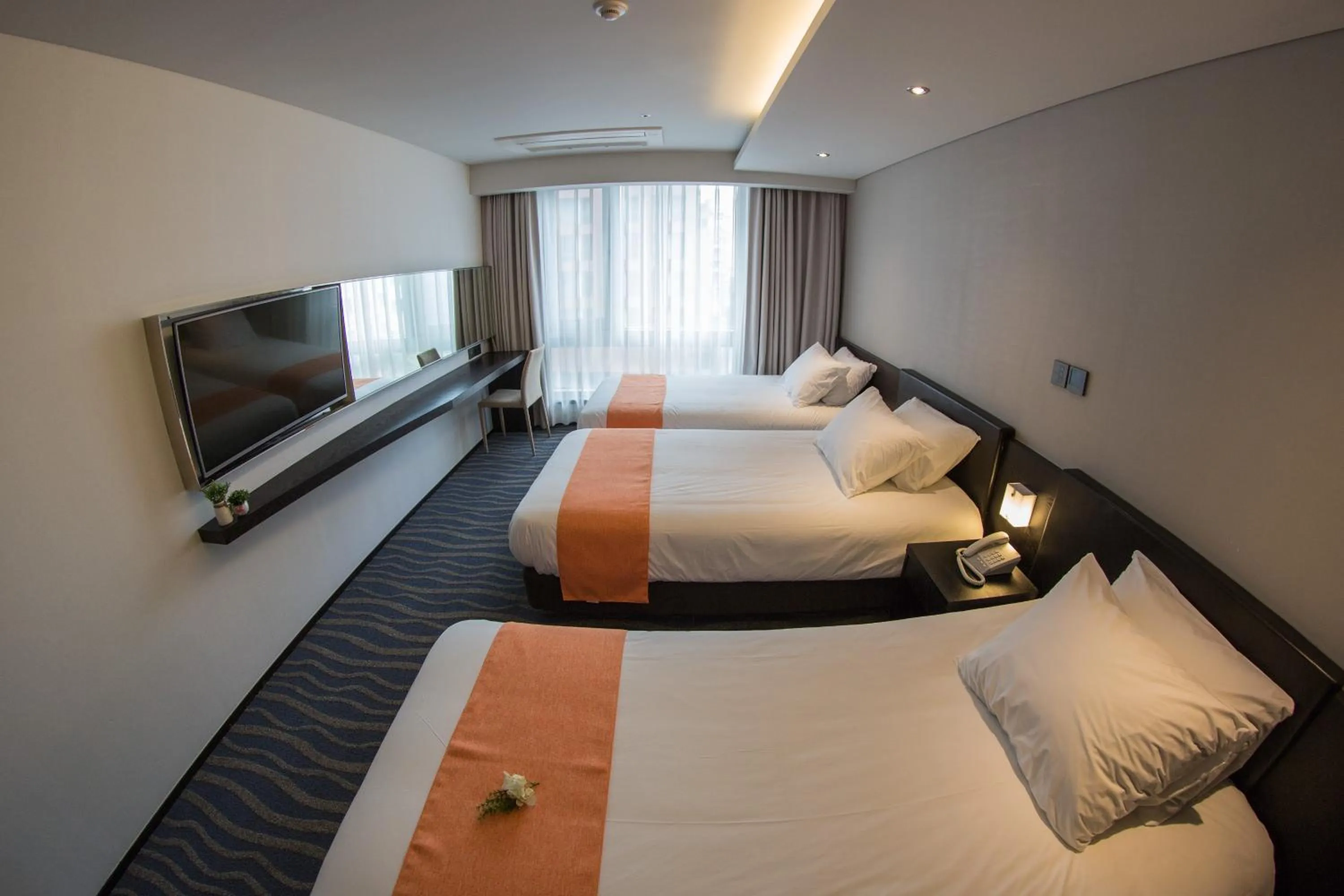 Bed in Gloucester Hotel Jeju