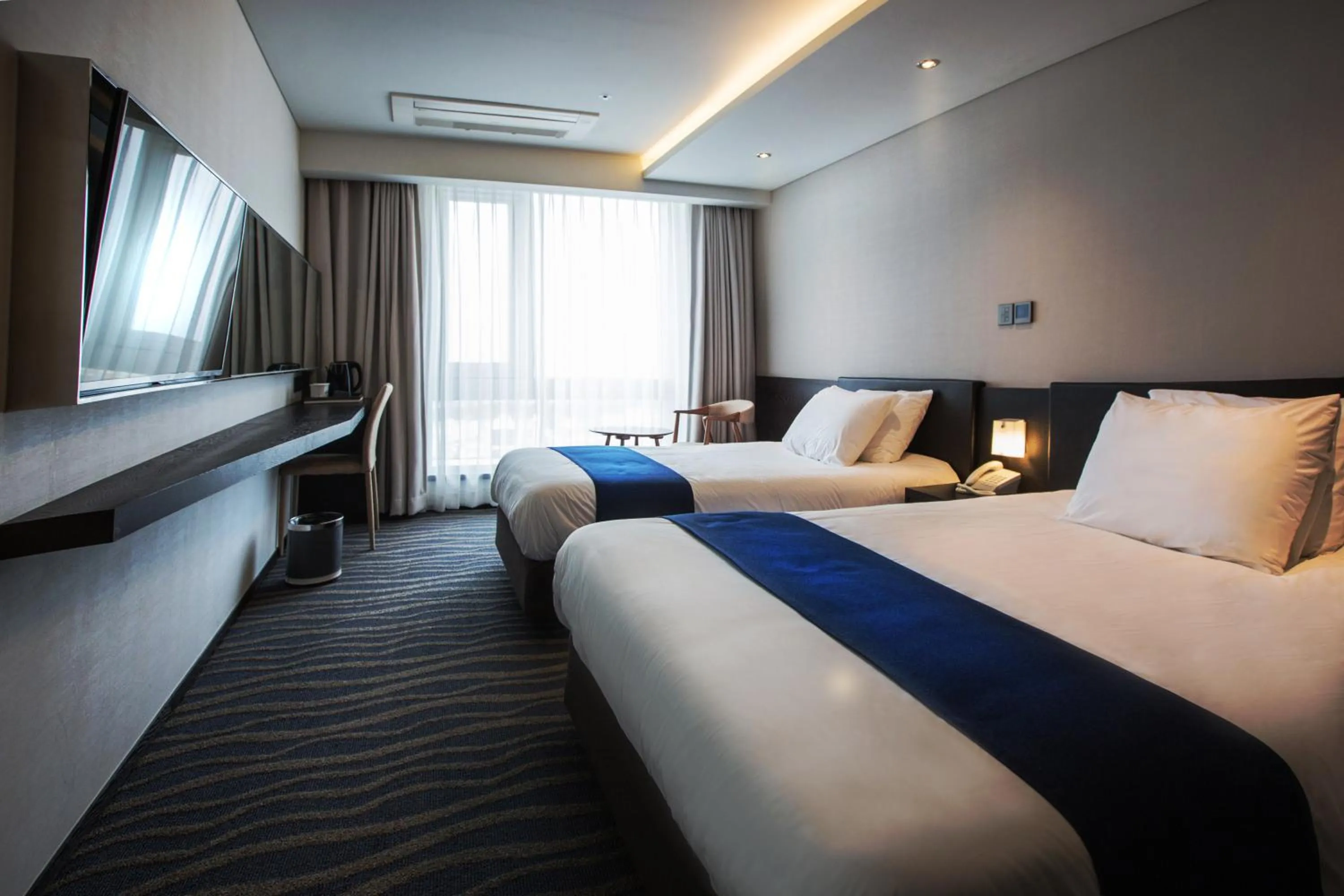 Bed in Gloucester Hotel Jeju