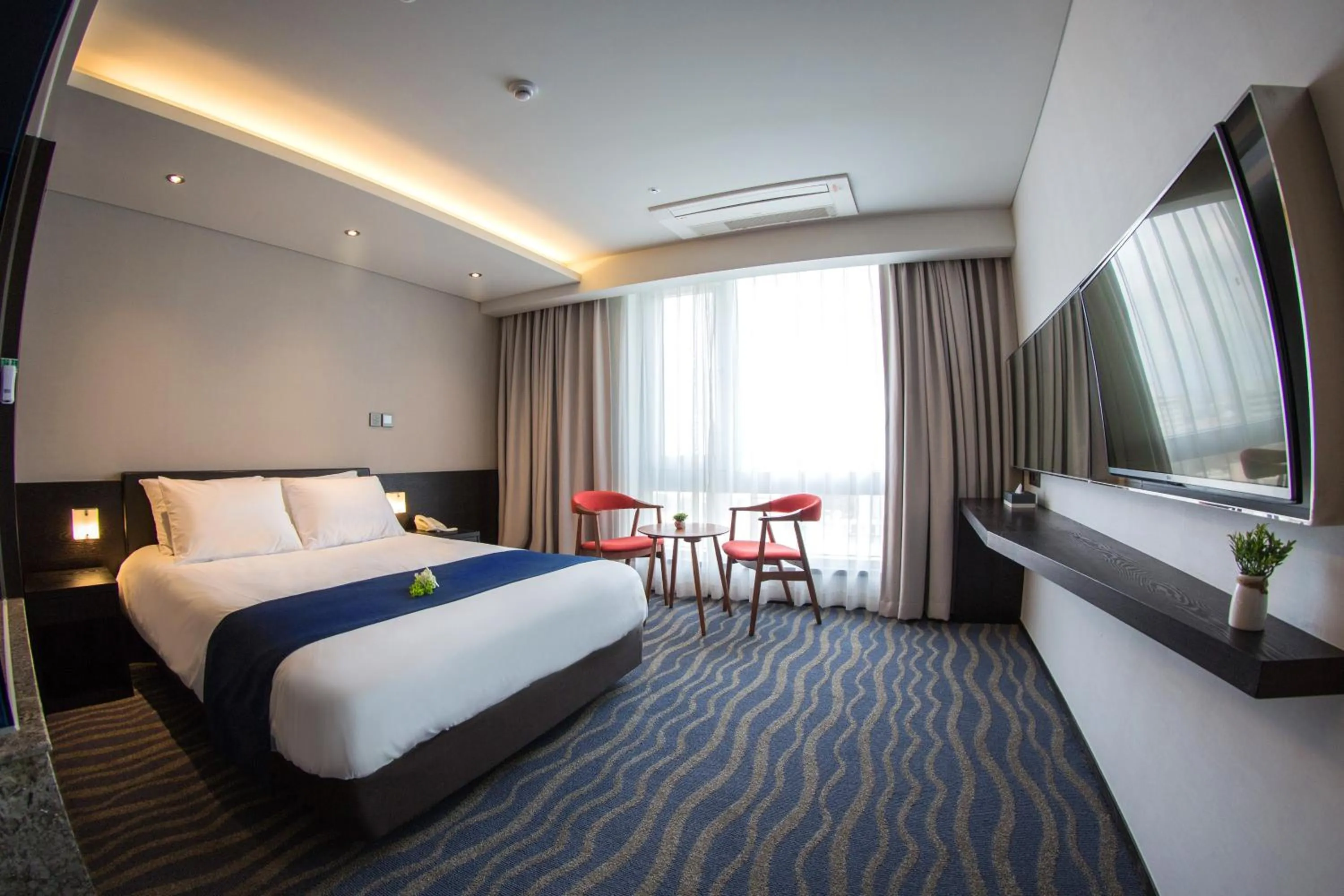 Bed in Gloucester Hotel Jeju