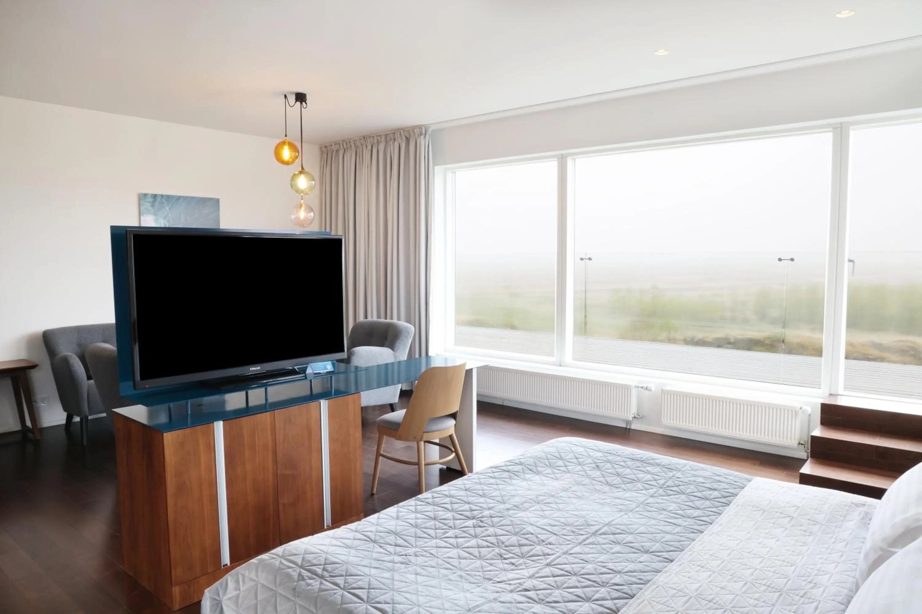 Communal lounge/ TV room, Bed in Fosshotel Vatnajökull