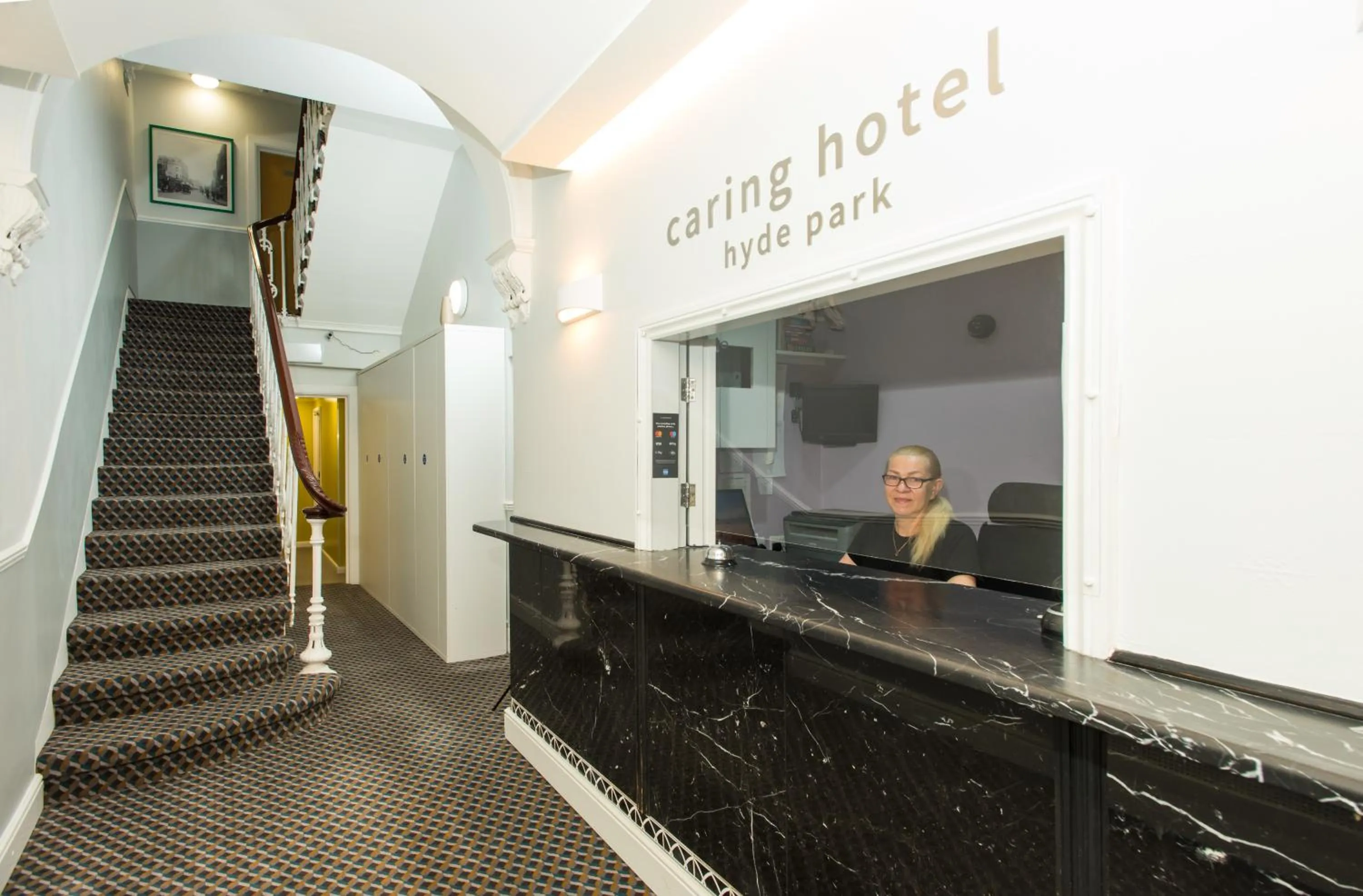 Lobby or reception in Caring Hotel