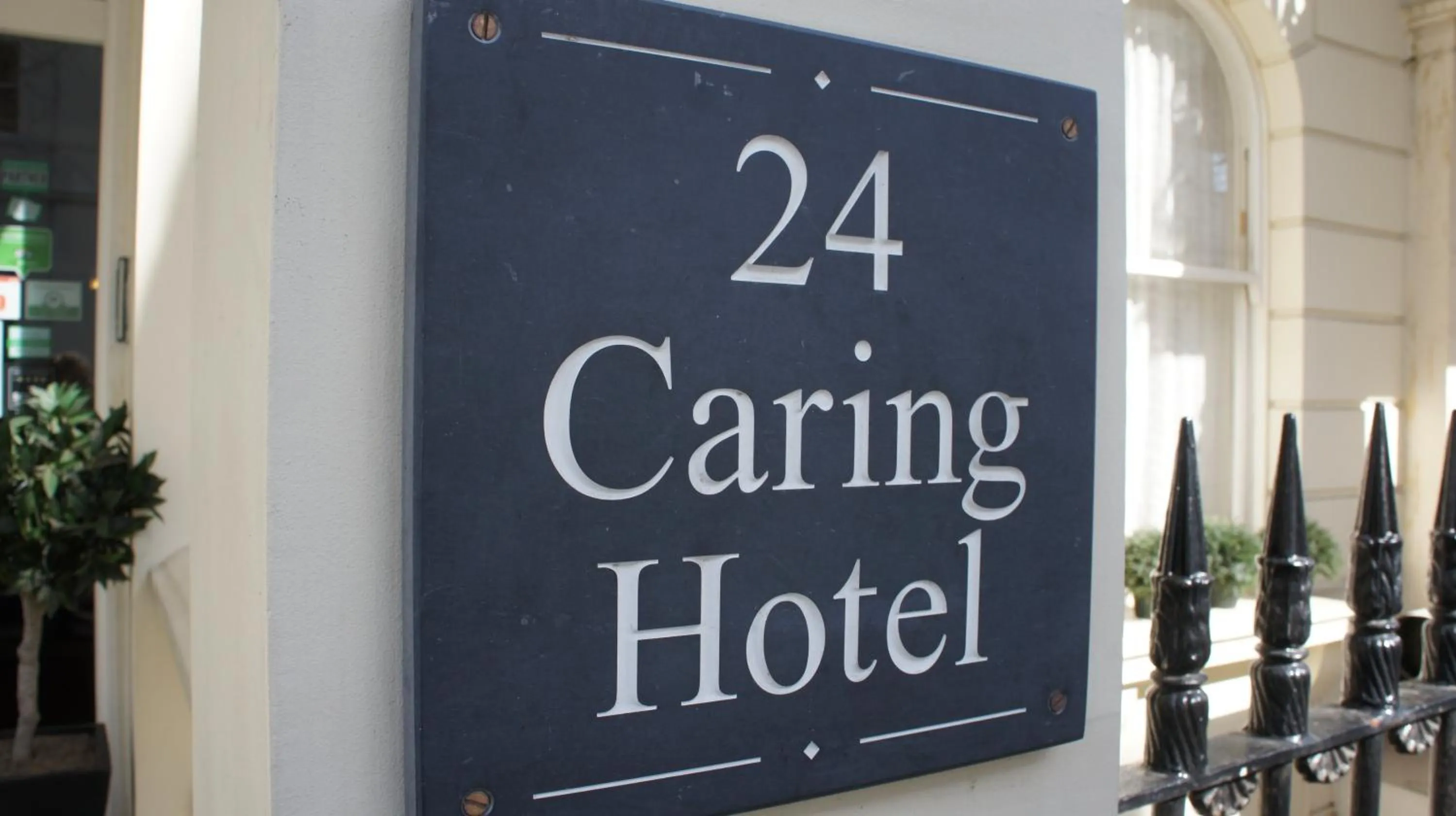 Property logo or sign in Caring Hotel