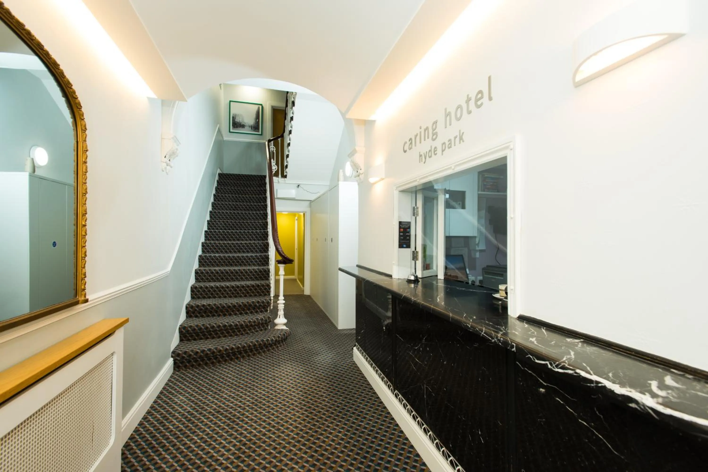 Lobby or reception in Caring Hotel