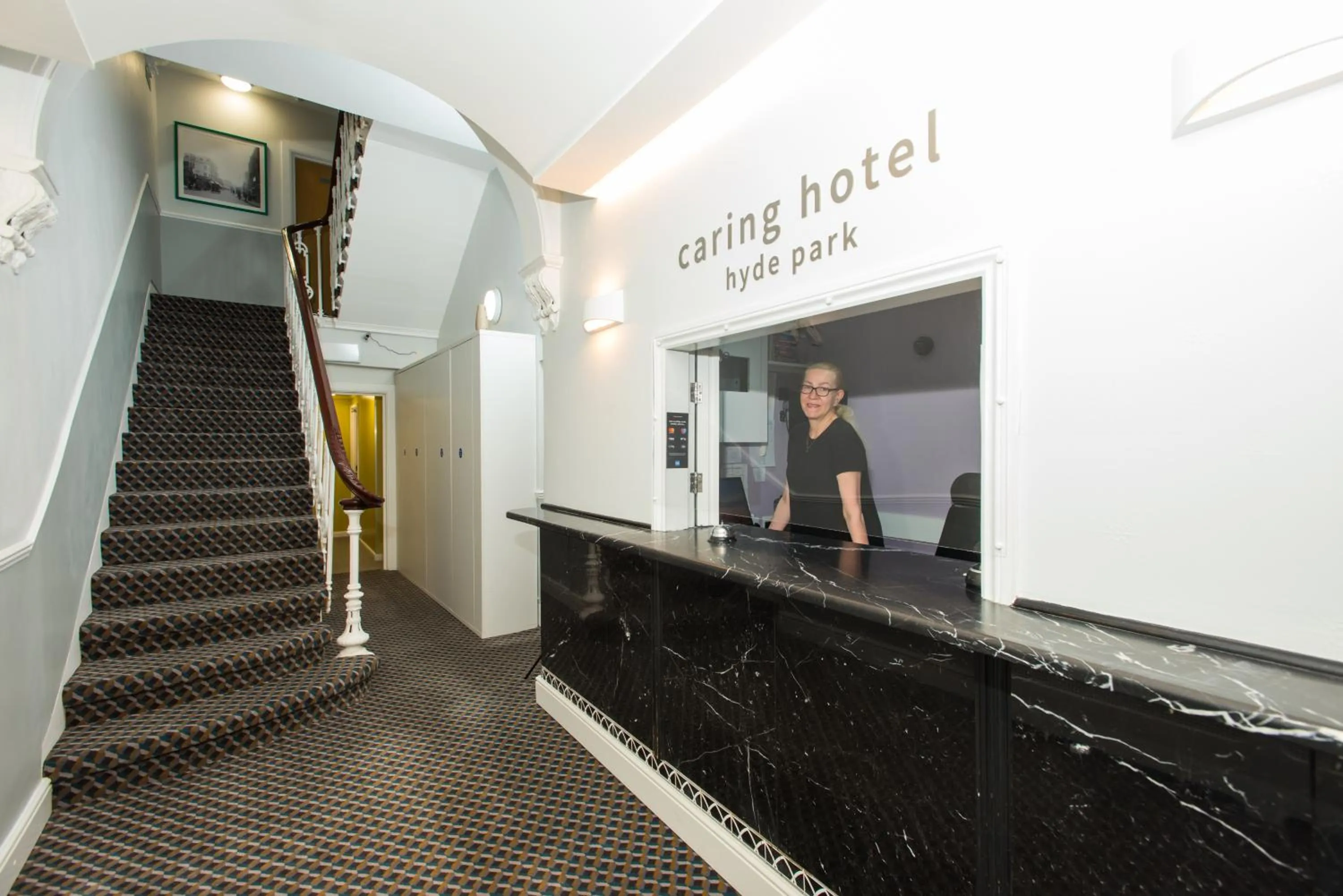 Lobby or reception in Caring Hotel