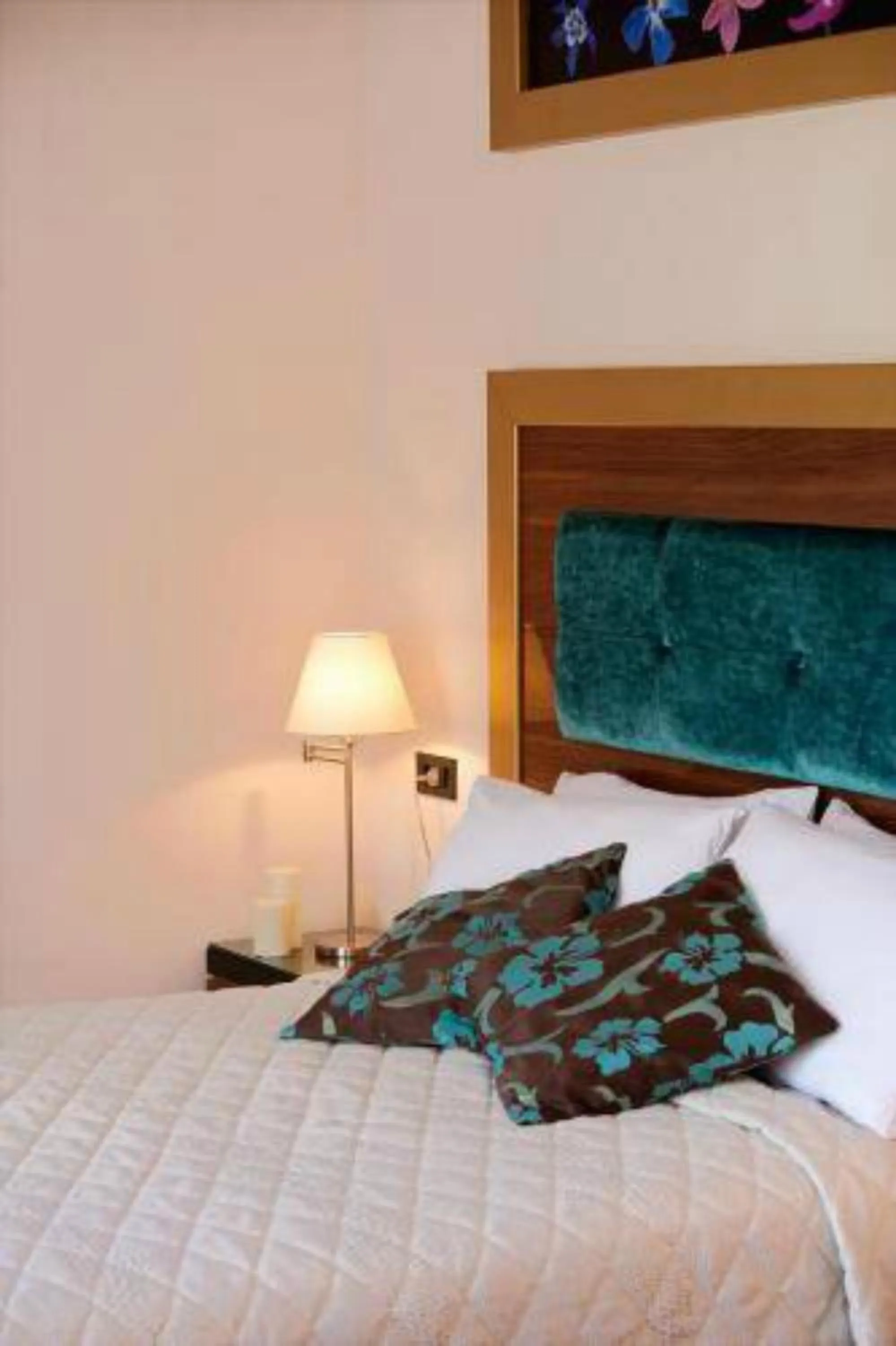 Bedroom in Dovitel Boutique Hotel