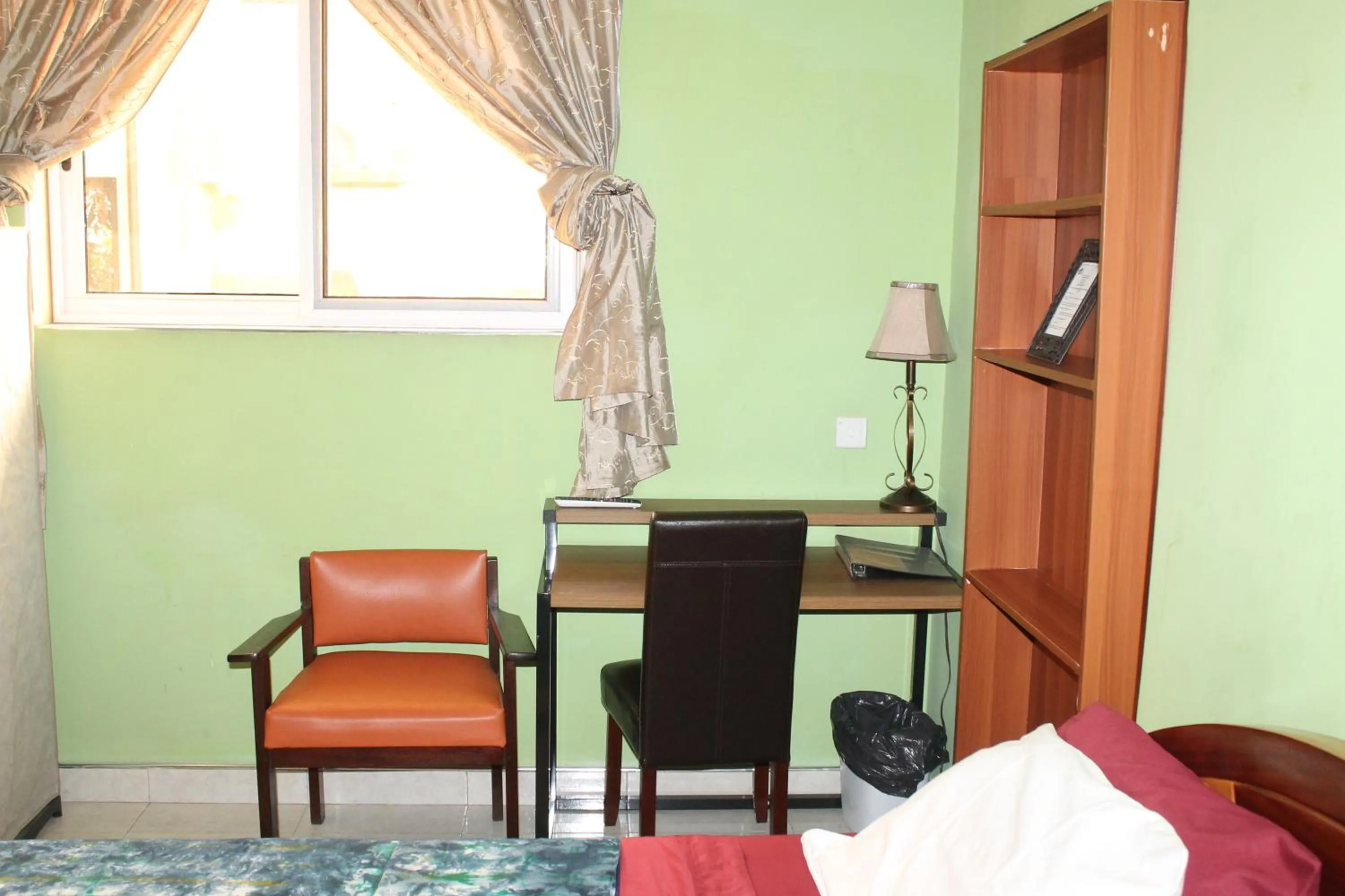 Seating area, Bed in Jesiwa B's Little Palace