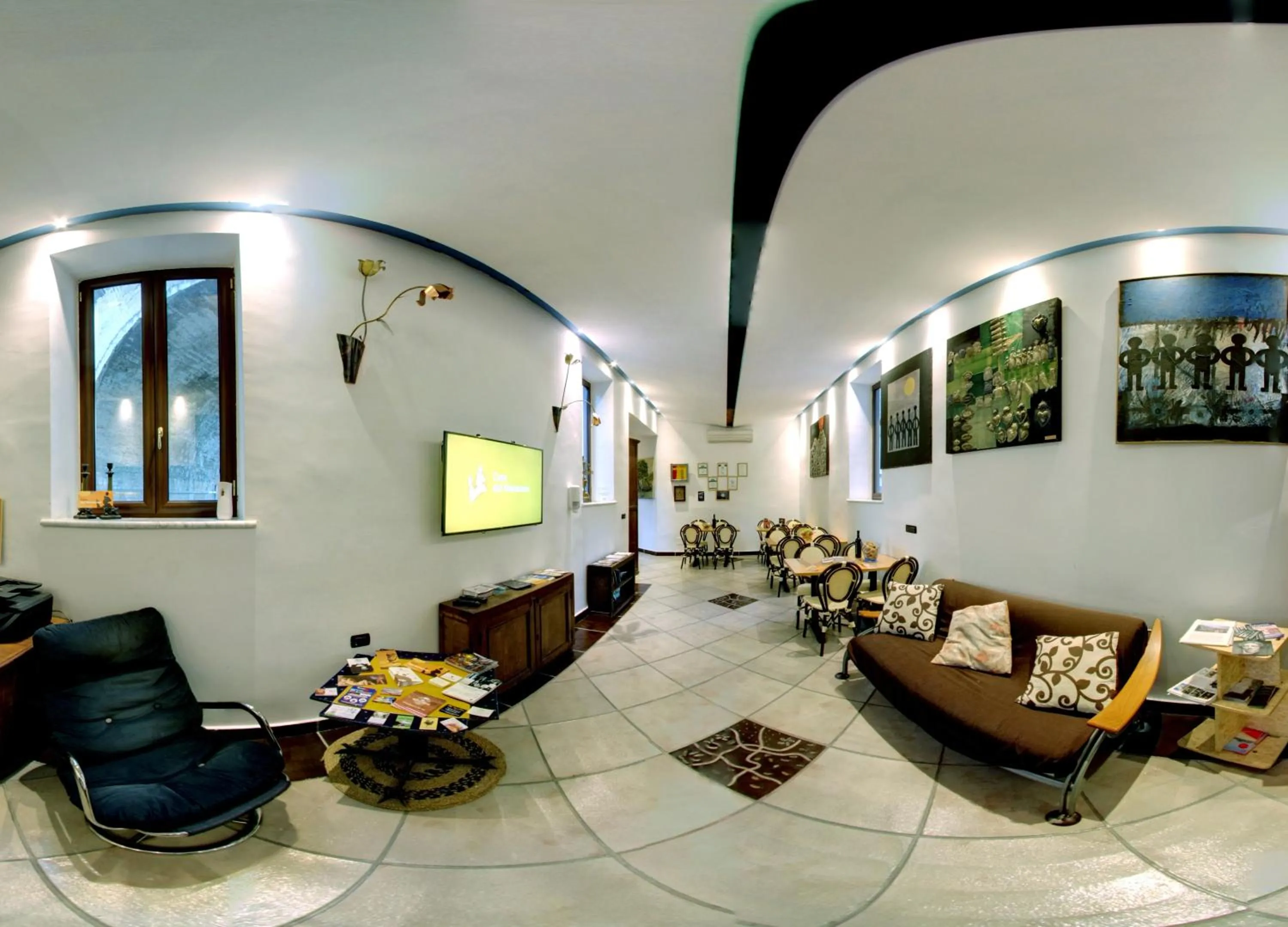 Communal lounge/ TV room in Casa del Monacone