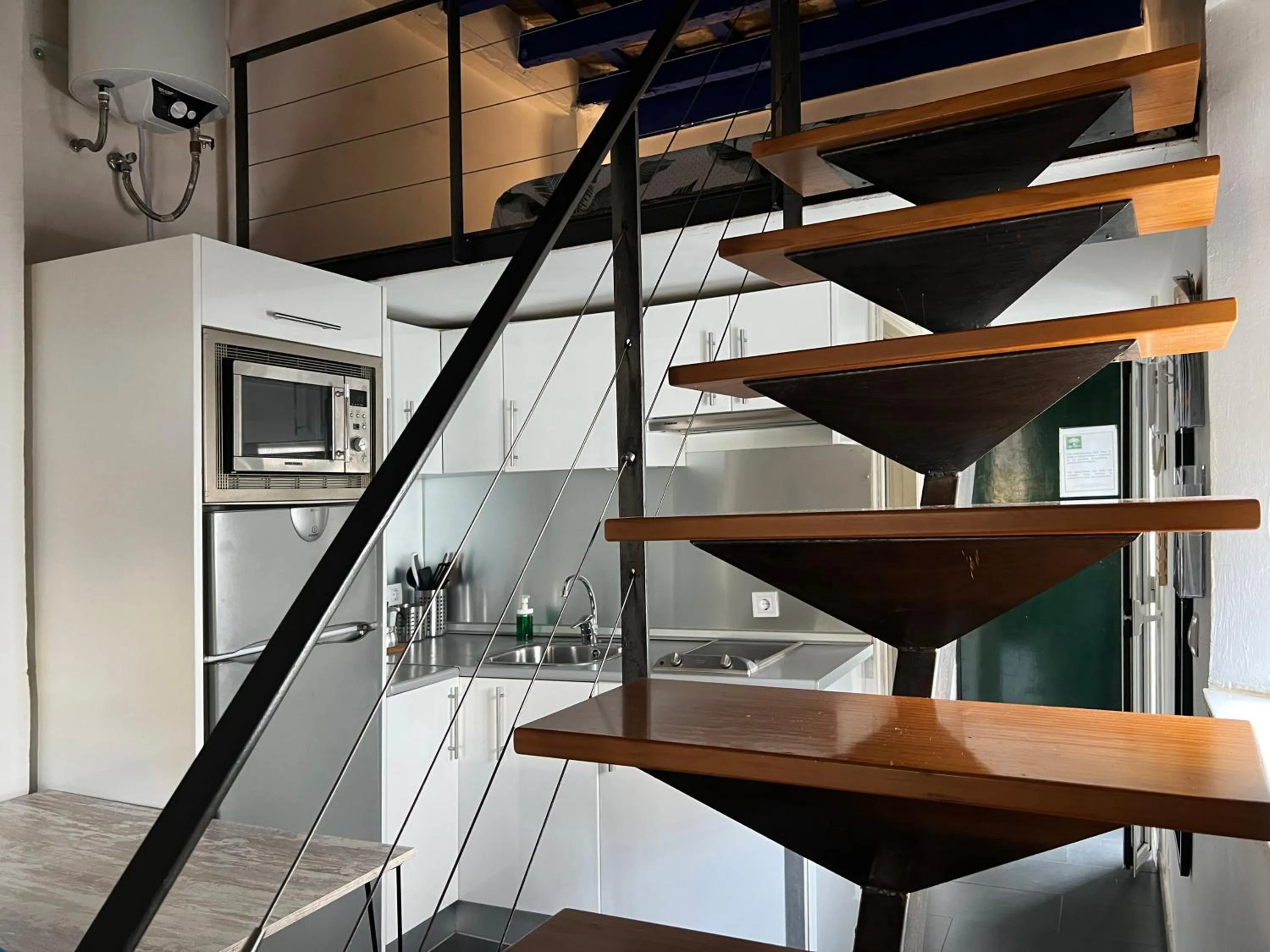 Kitchen or kitchenette in Apartamentos Triana - Aloha Sevilla