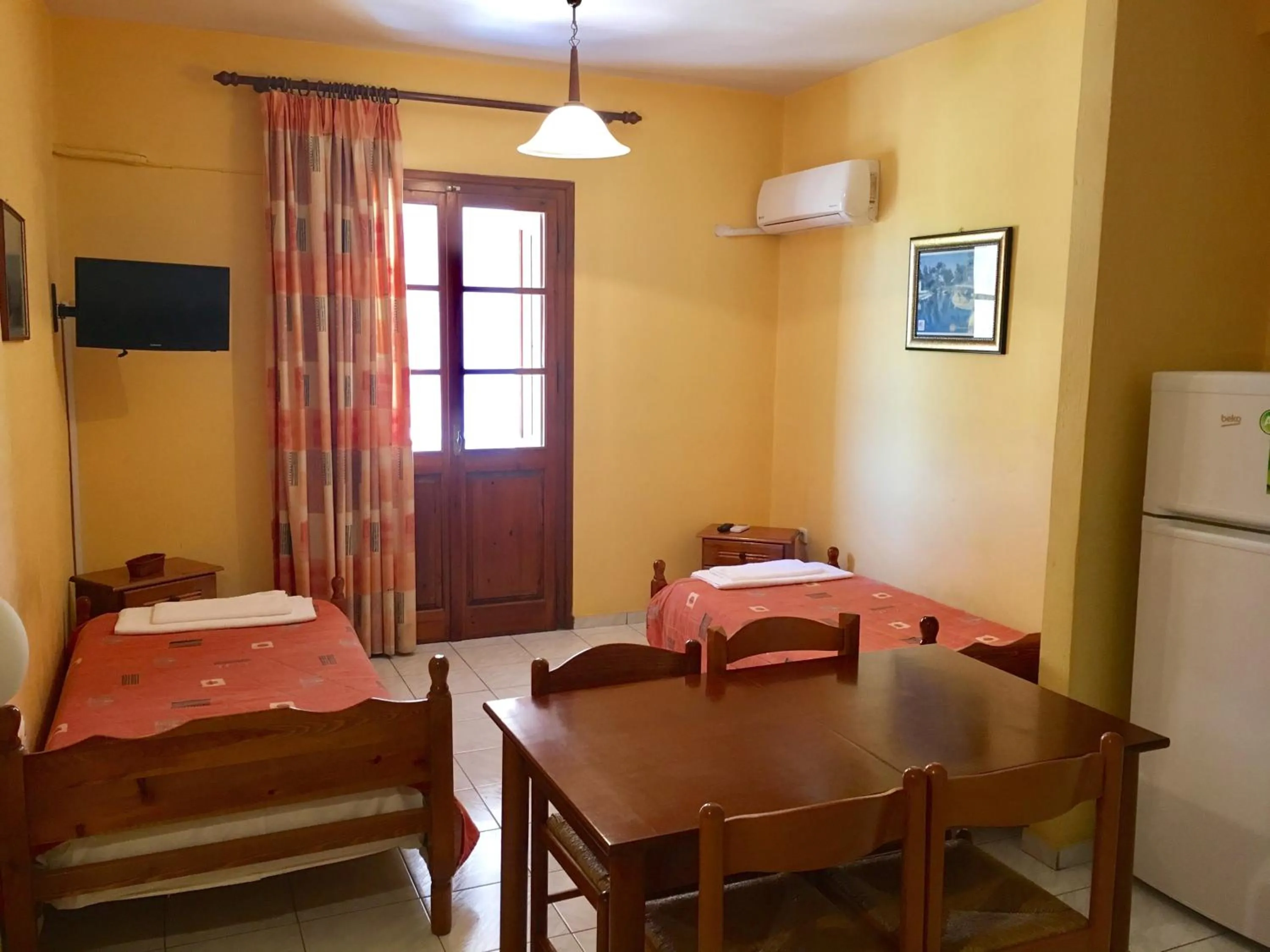 Kitchen or kitchenette, Bed in Argo Apartments near Nafplio
