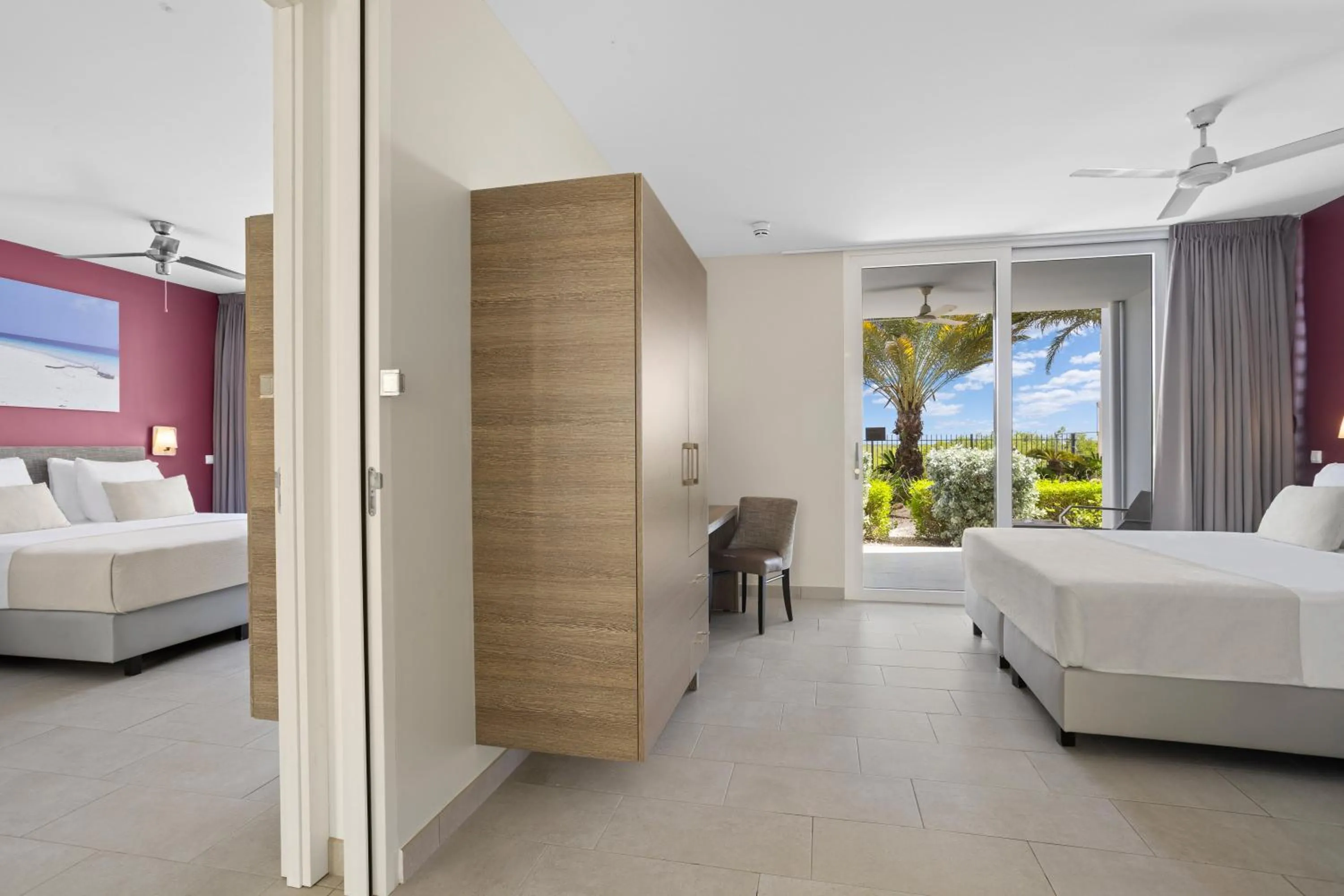 Bed in Delfins Beach Resort Bonaire, Tapestry Collection by Hilton