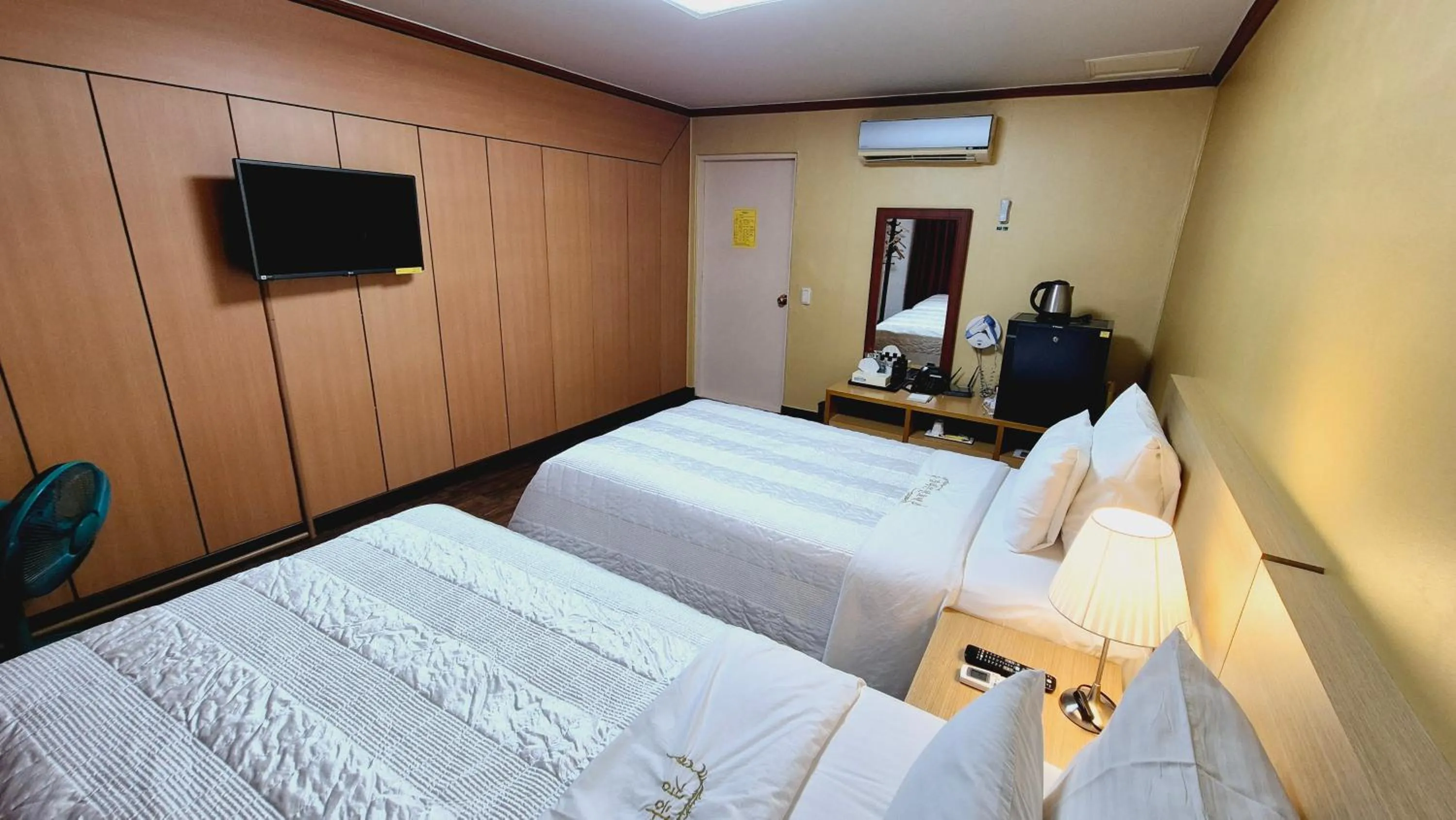 Bed in Kyungha Spa Hotel