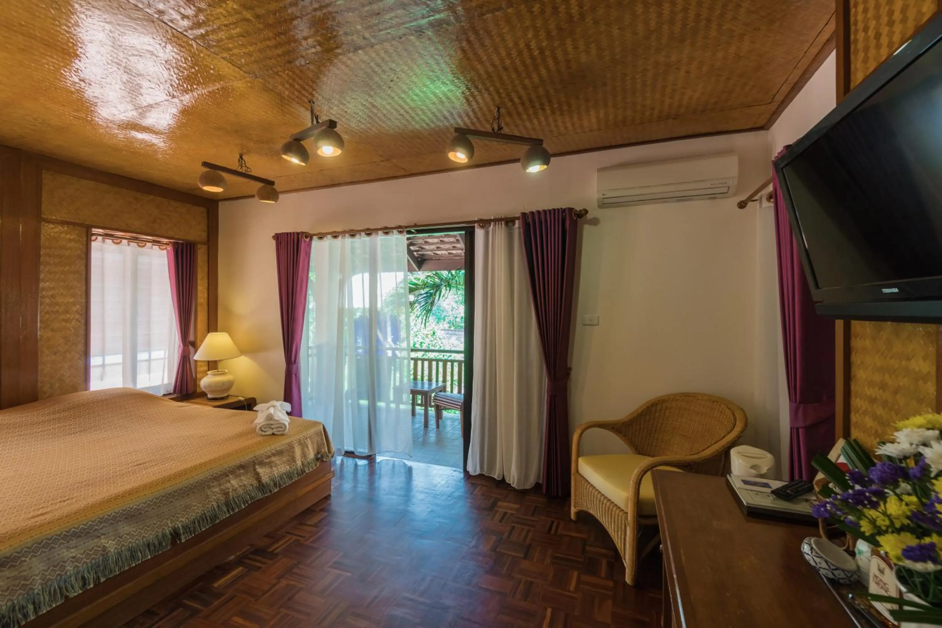 Photo of the whole room, Bed in Coral Hotel Bangsaphan