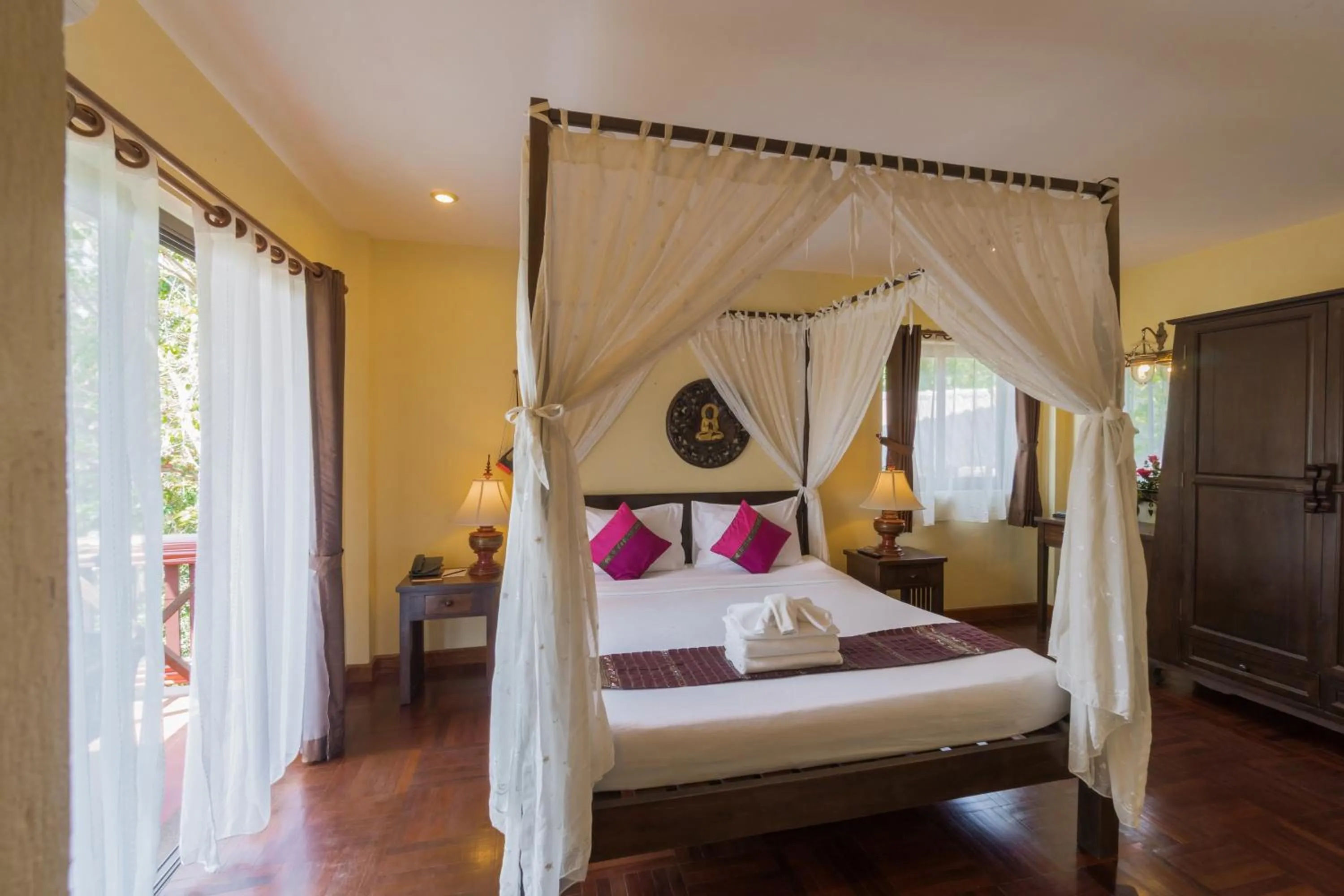 Photo of the whole room, Bed in Coral Hotel Bangsaphan