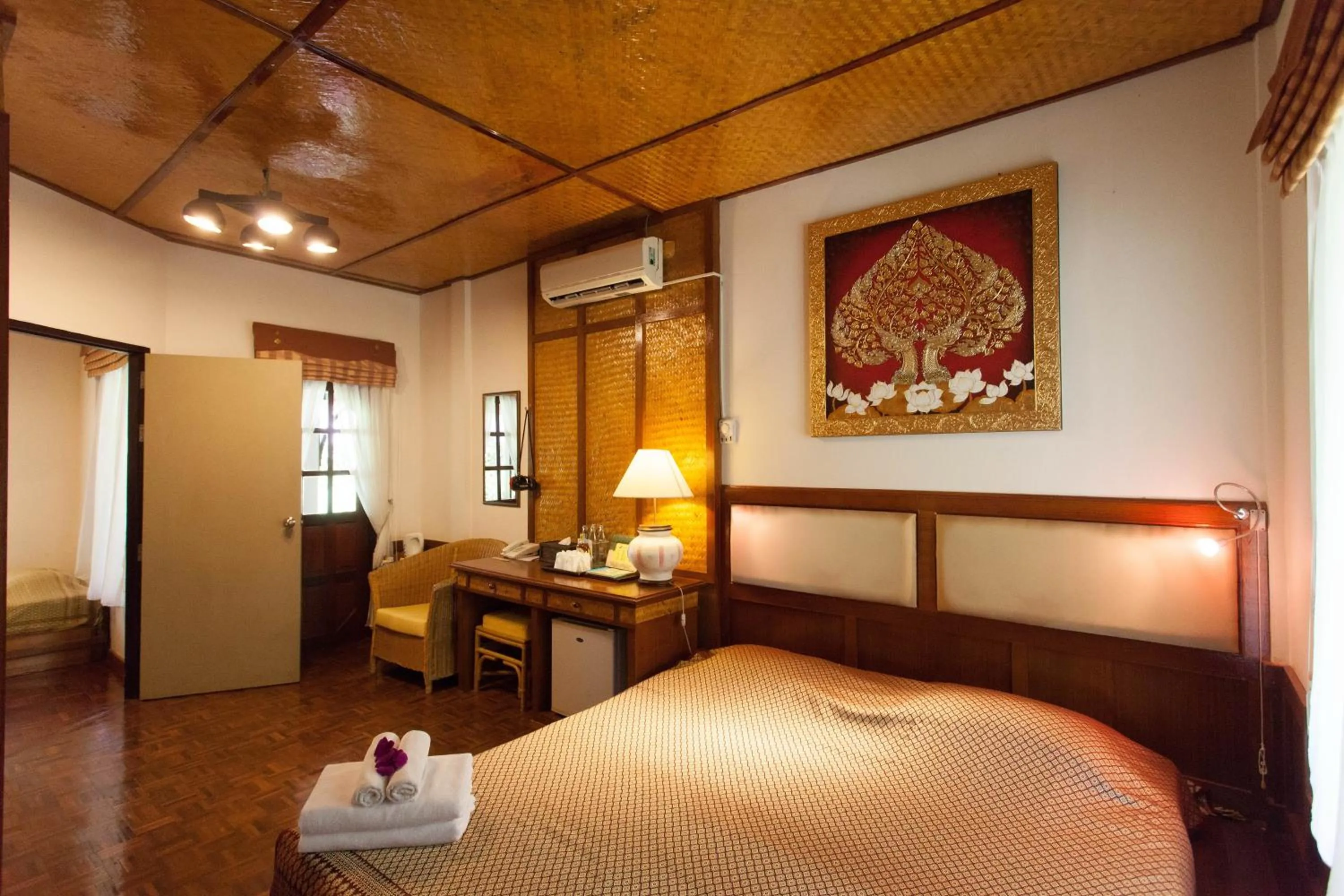 Photo of the whole room, Bed in Coral Hotel Bangsaphan