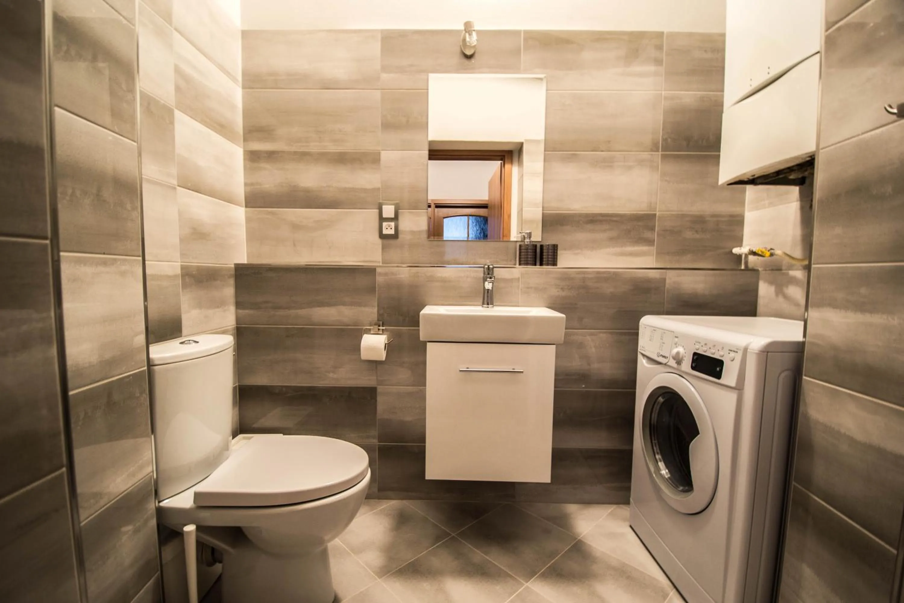Toilet in 4BDR Historical Spirit Apt by Ruterra