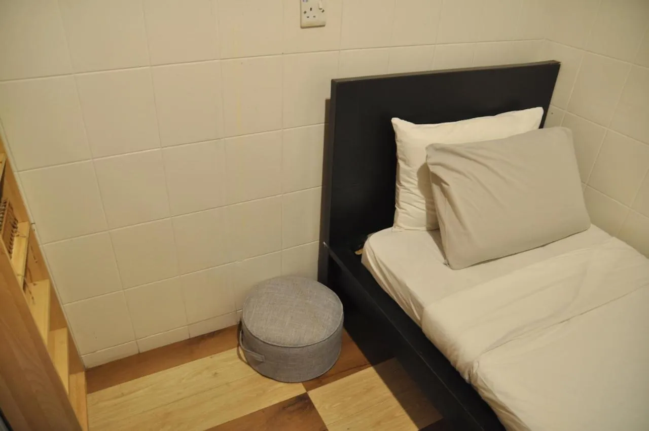 Bed in GRAYHAUS Guest House