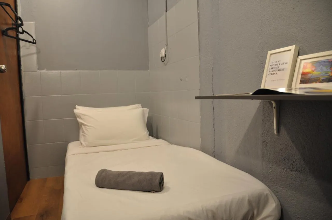 Bed in GRAYHAUS Guest House