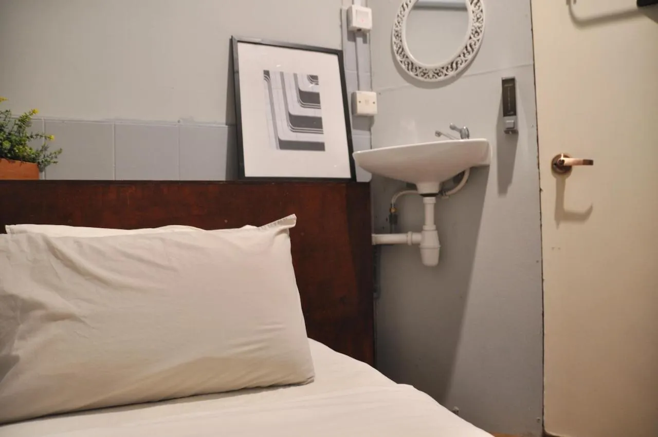 Bed in GRAYHAUS Guest House