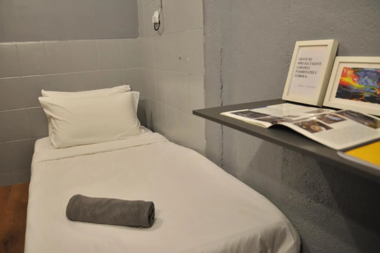 Bed in GRAYHAUS Guest House