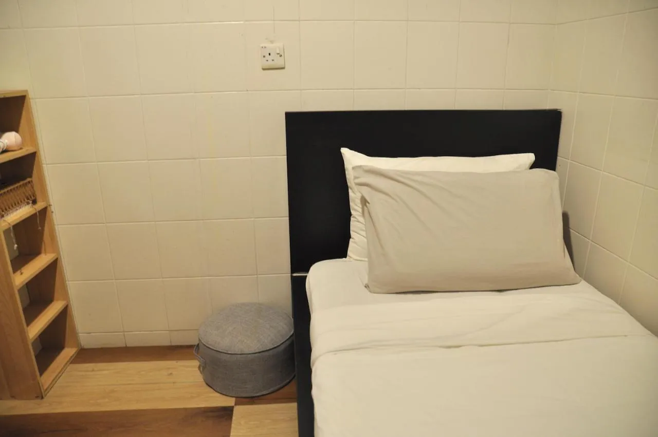 Bed in GRAYHAUS Guest House