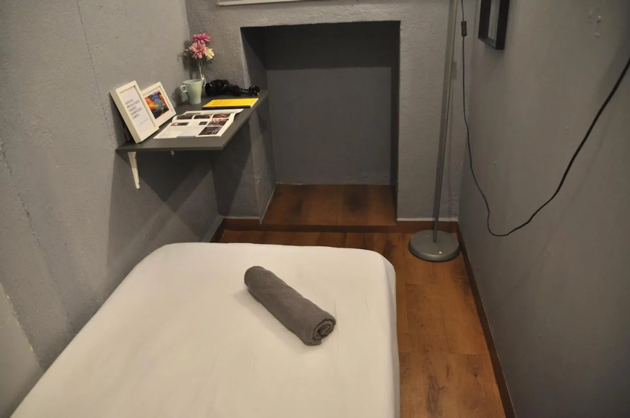 Bed in GRAYHAUS Guest House