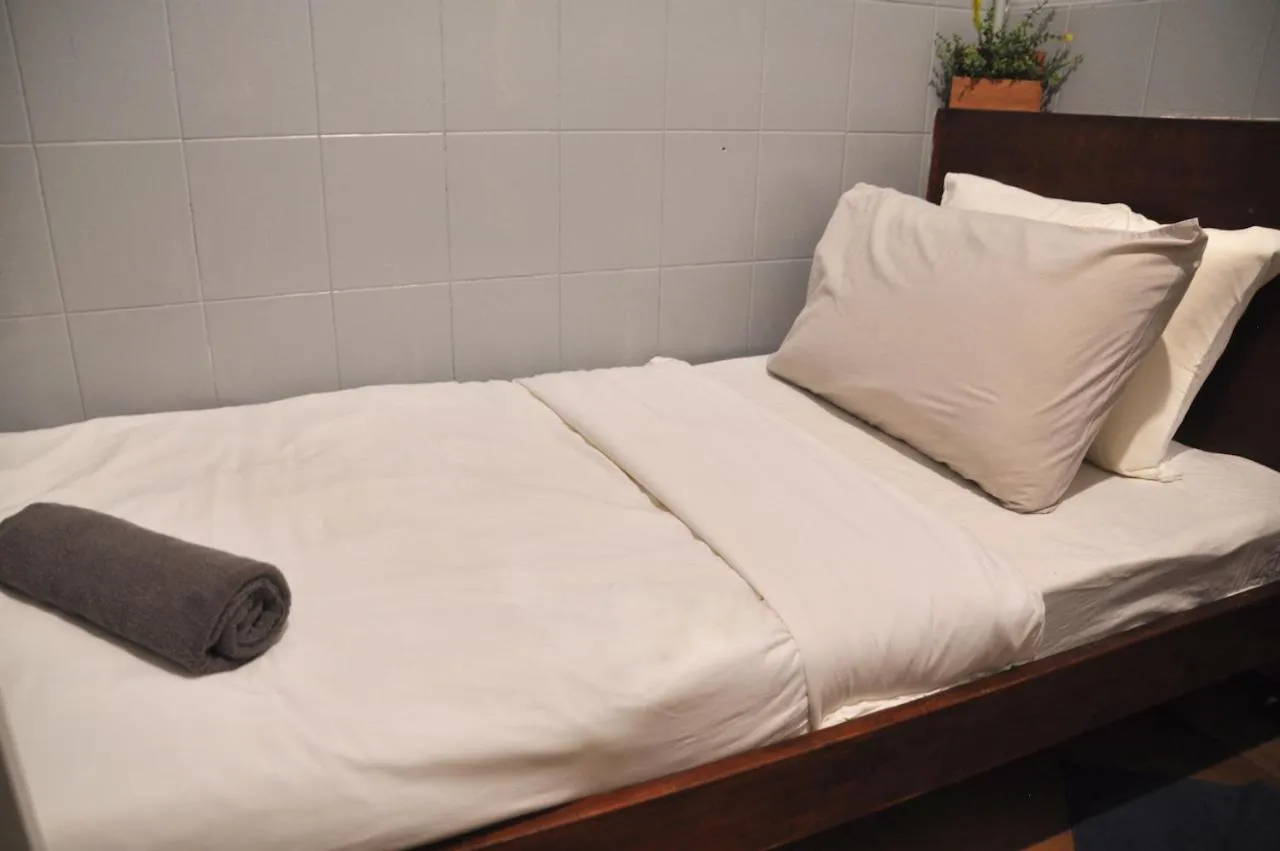 Bed in GRAYHAUS Guest House