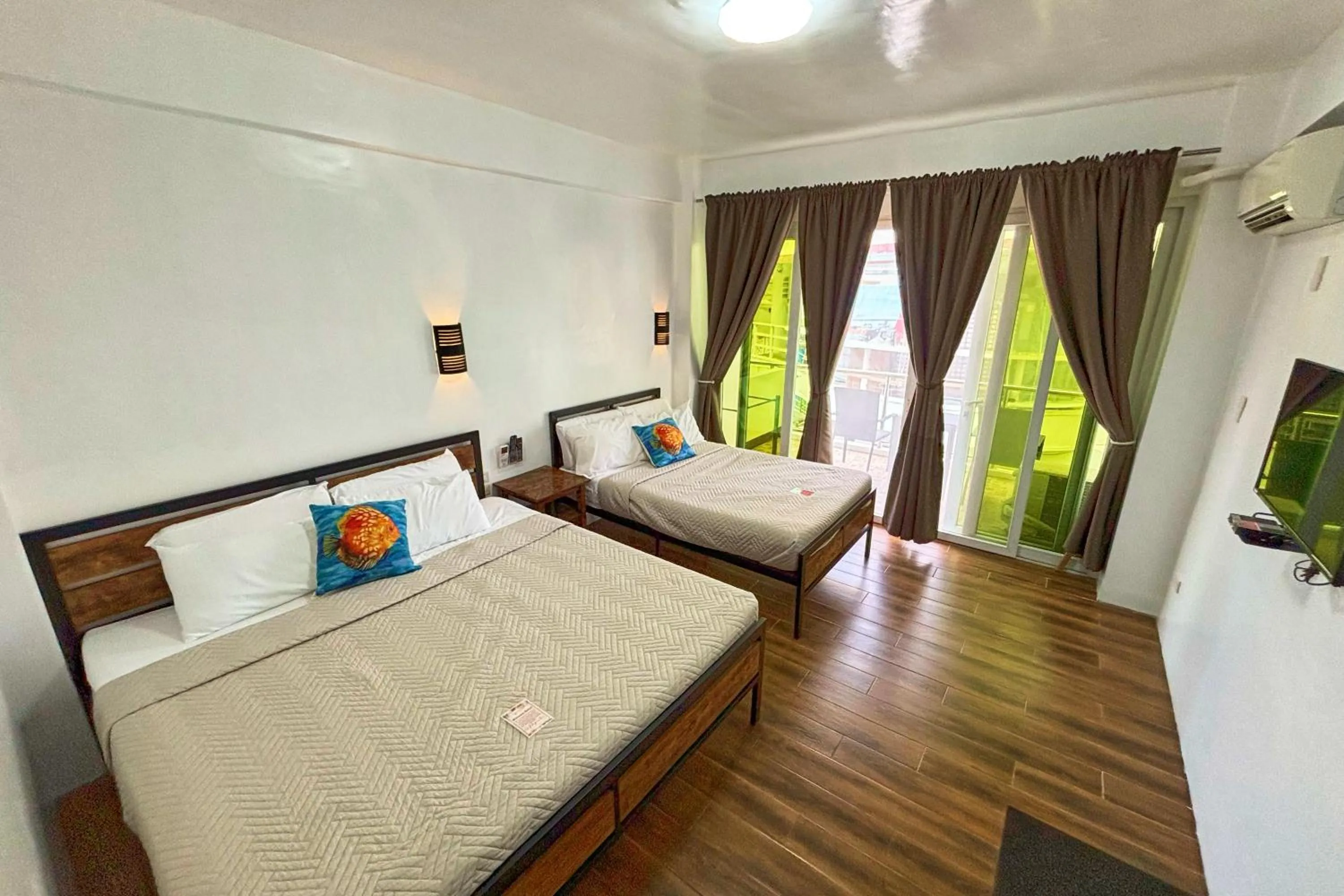 Bed in Arkipelago Divers and Beach Resort