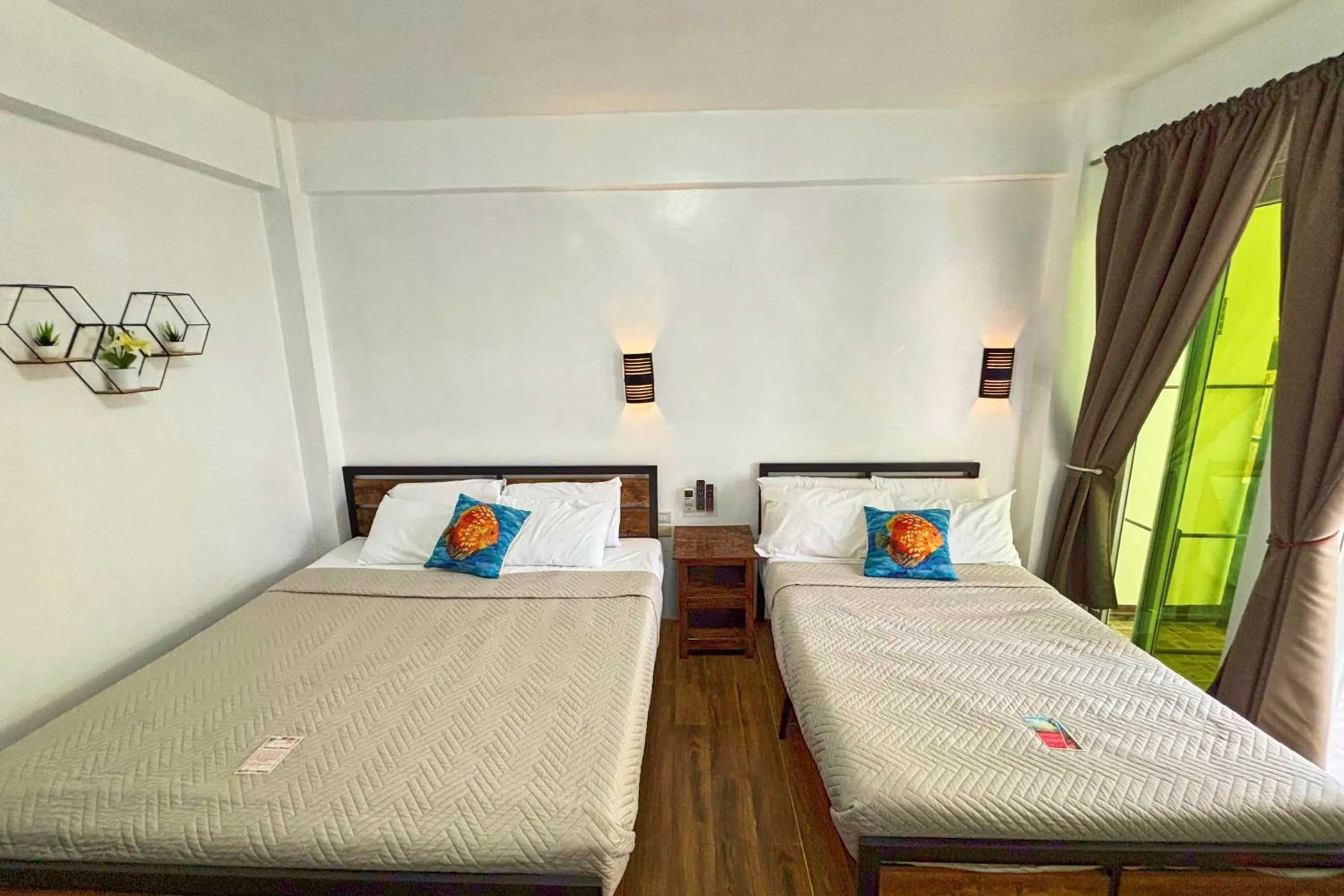 Bed in Arkipelago Divers and Beach Resort