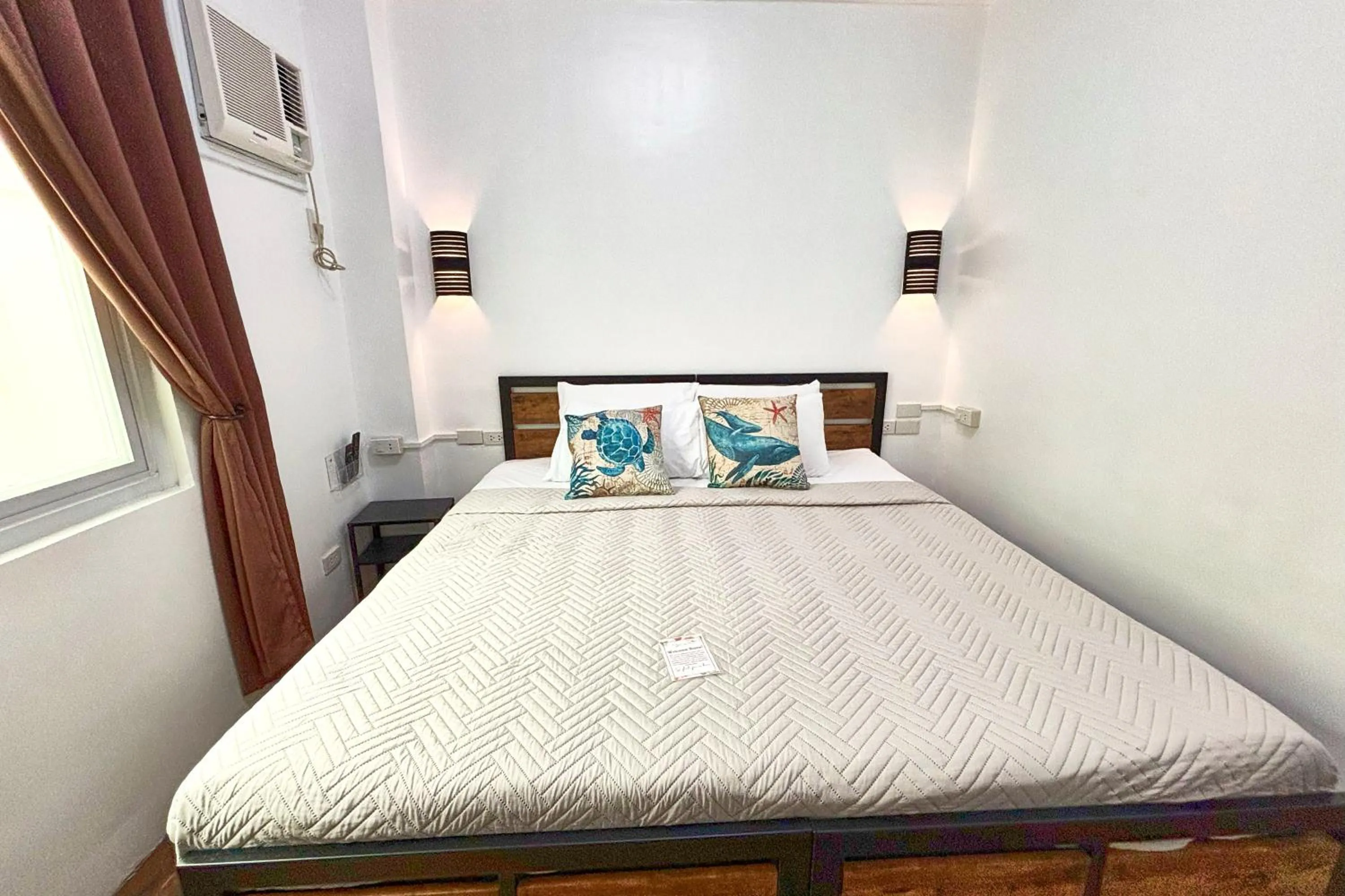 Bed in Arkipelago Divers and Beach Resort