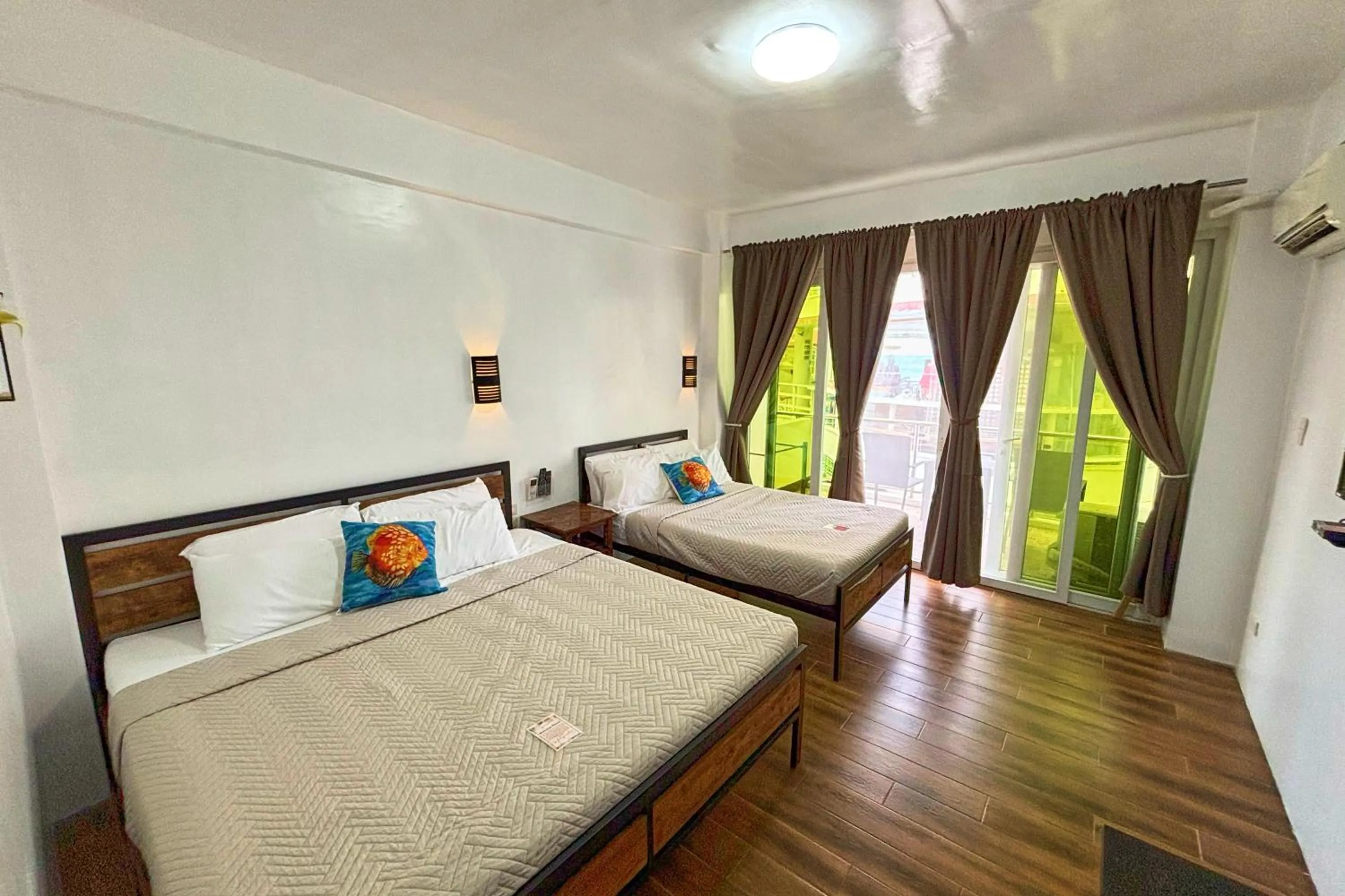 Bed in Arkipelago Divers and Beach Resort