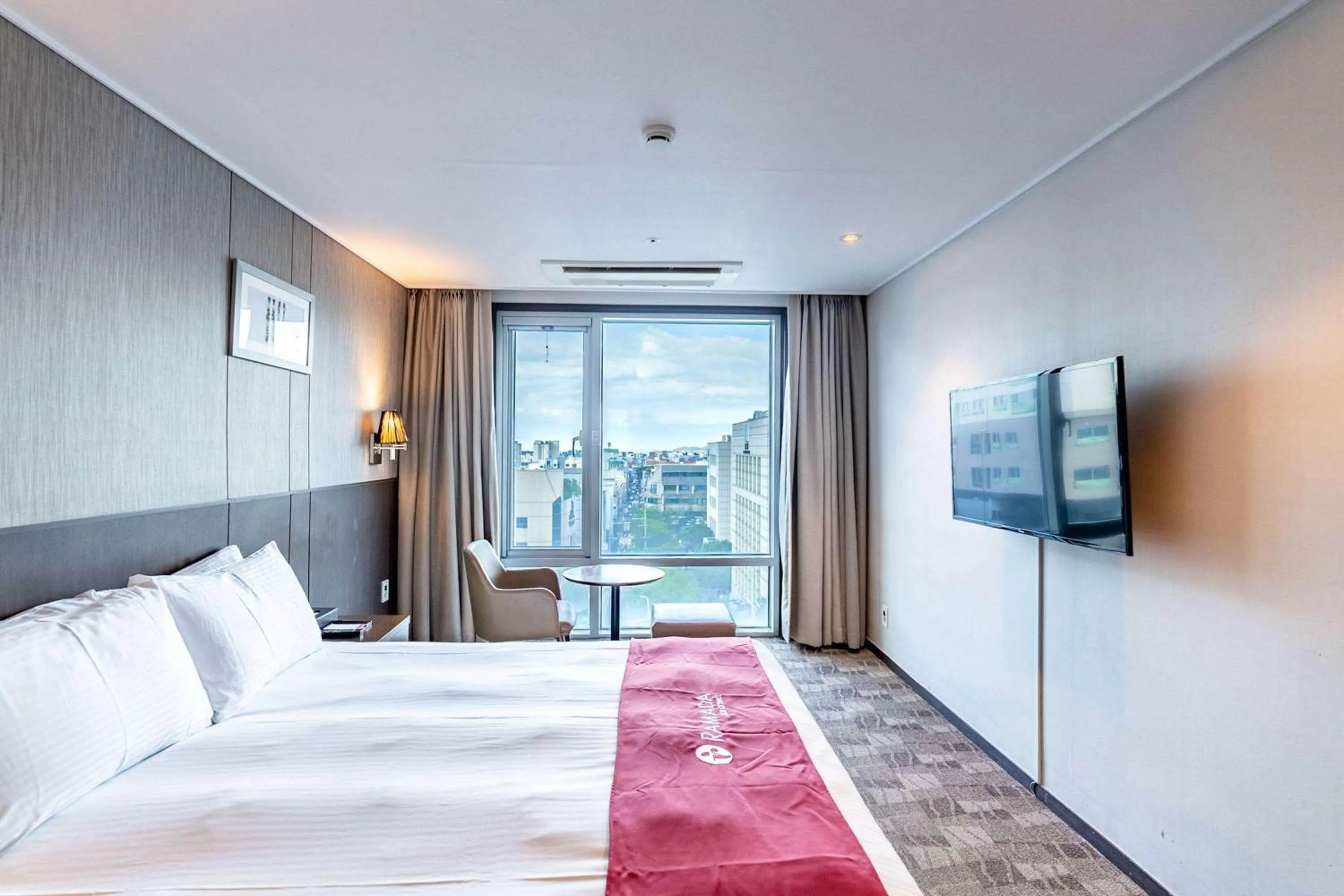 Photo of the whole room, Bed in Ramada by Wyndham Jeju City Hall