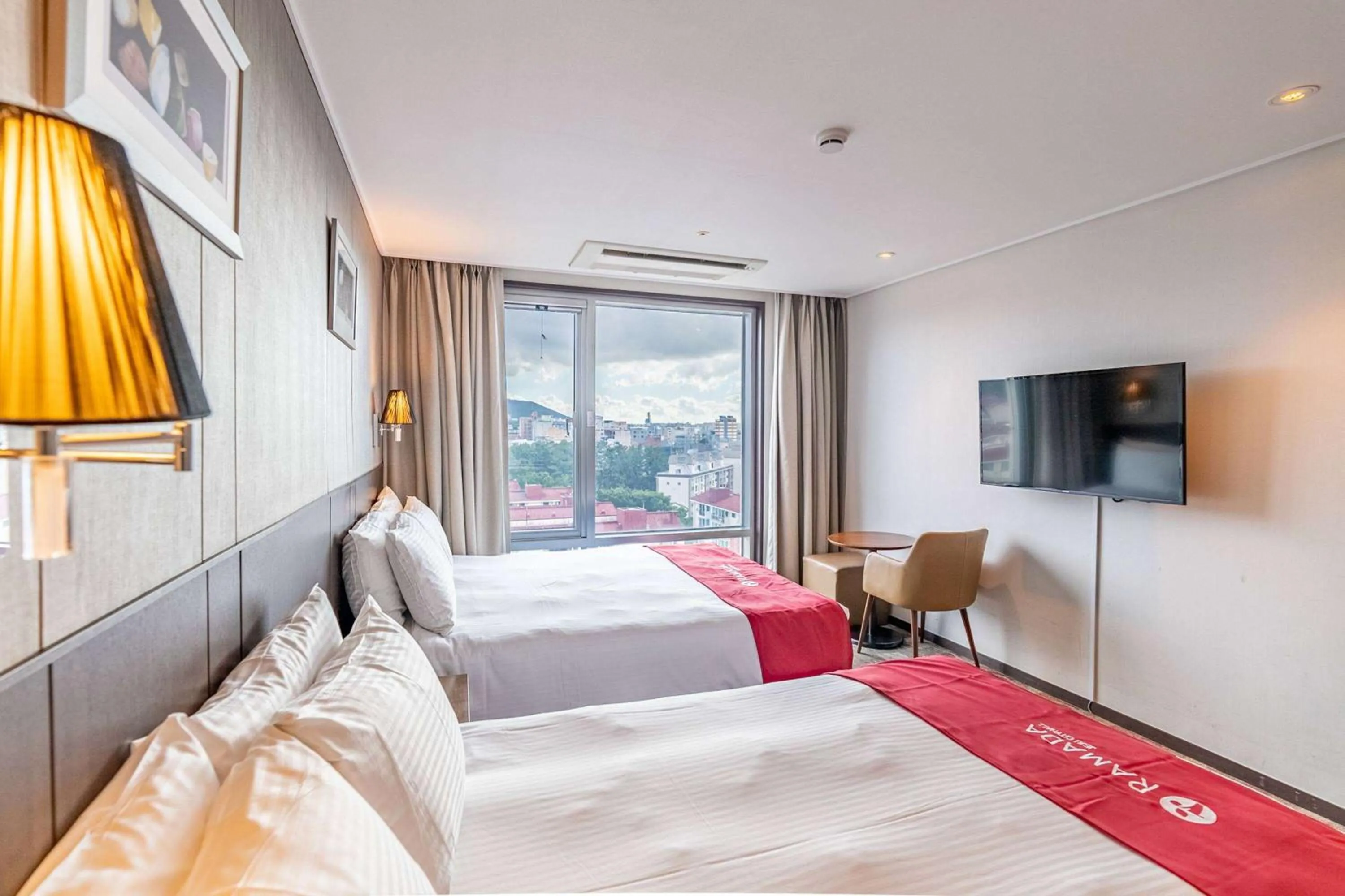 Photo of the whole room, Bed in Ramada by Wyndham Jeju City Hall