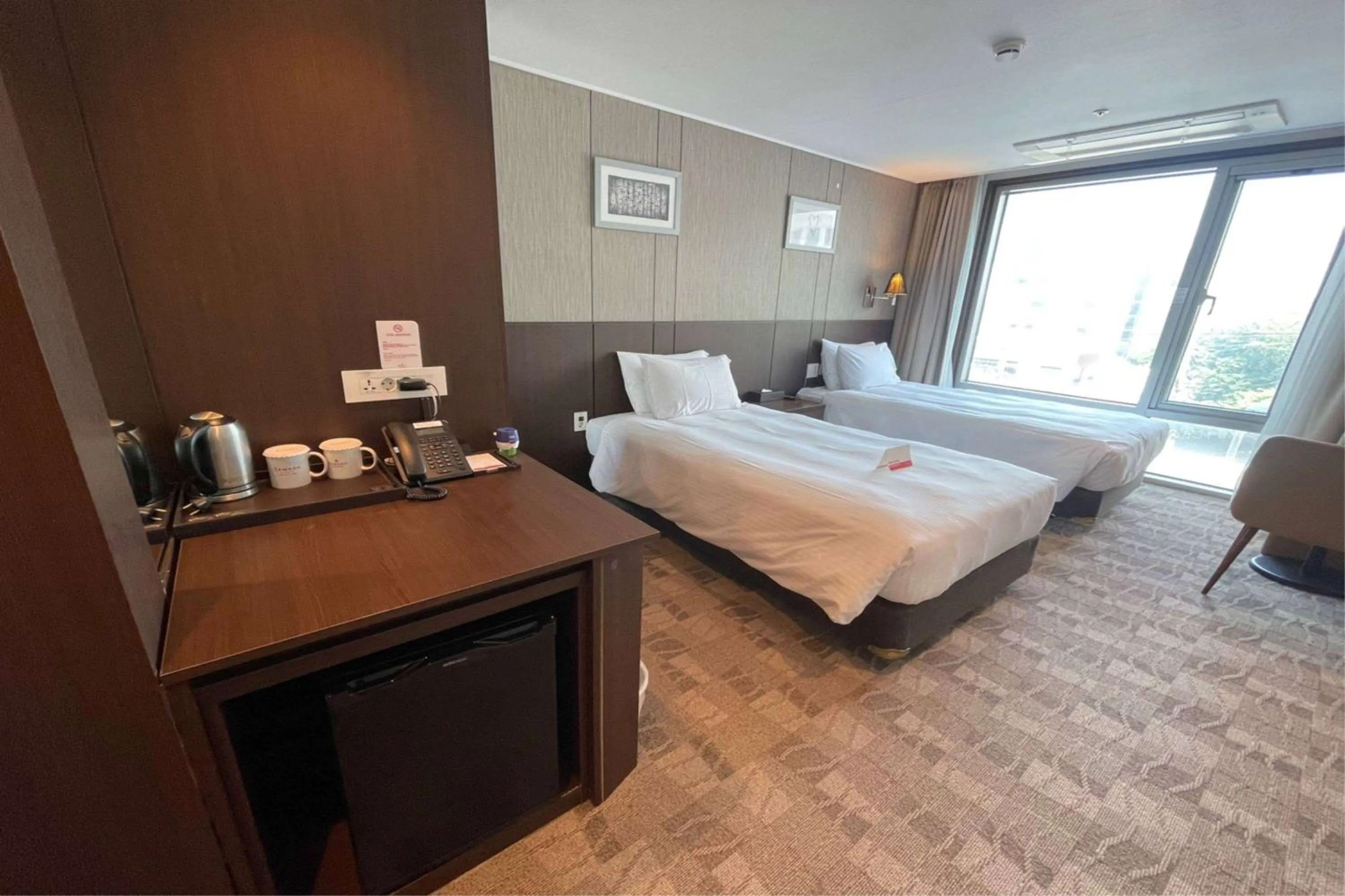Photo of the whole room, Bed in Ramada by Wyndham Jeju City Hall