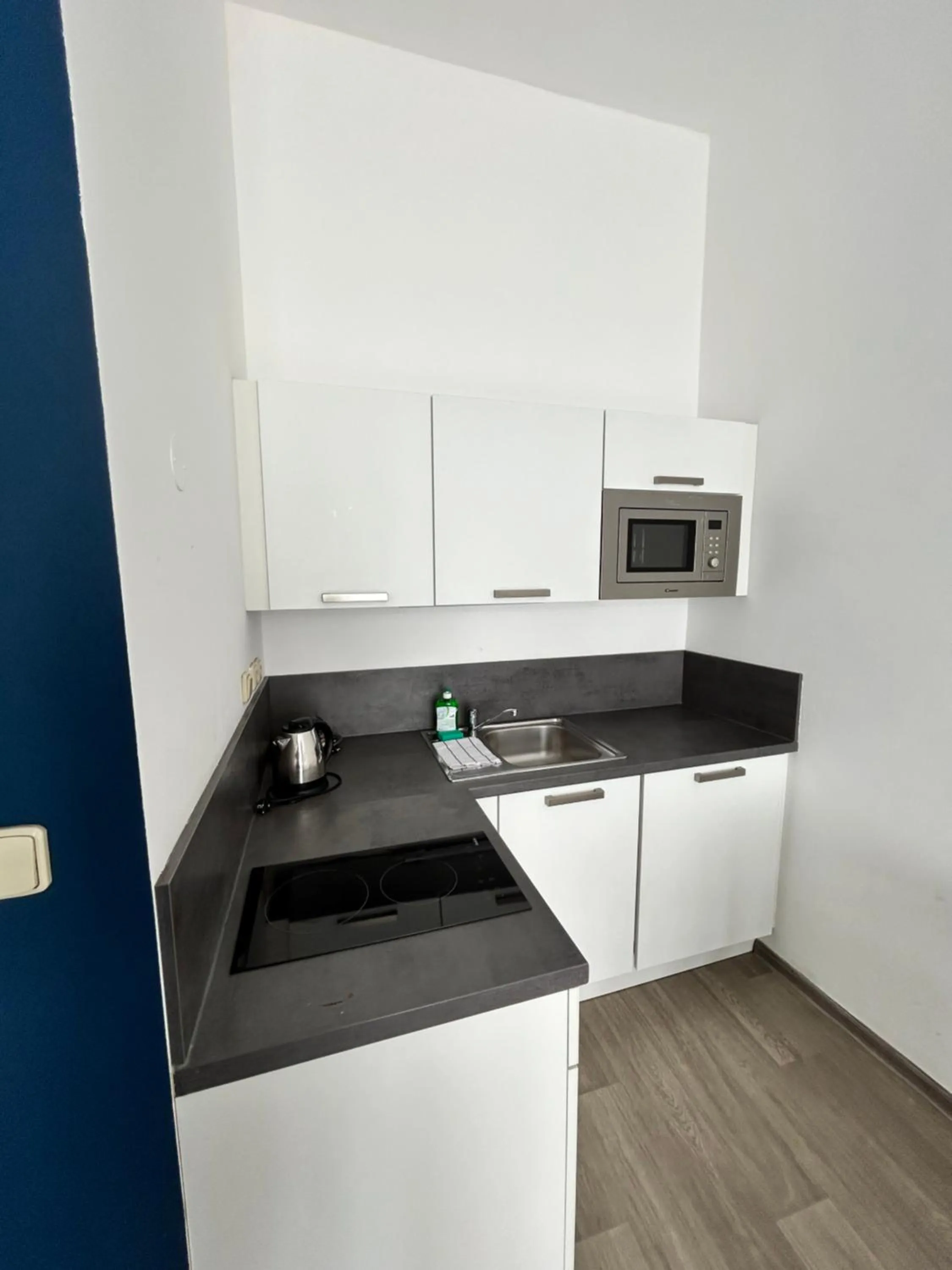 Kitchen or kitchenette in Alveo Suites